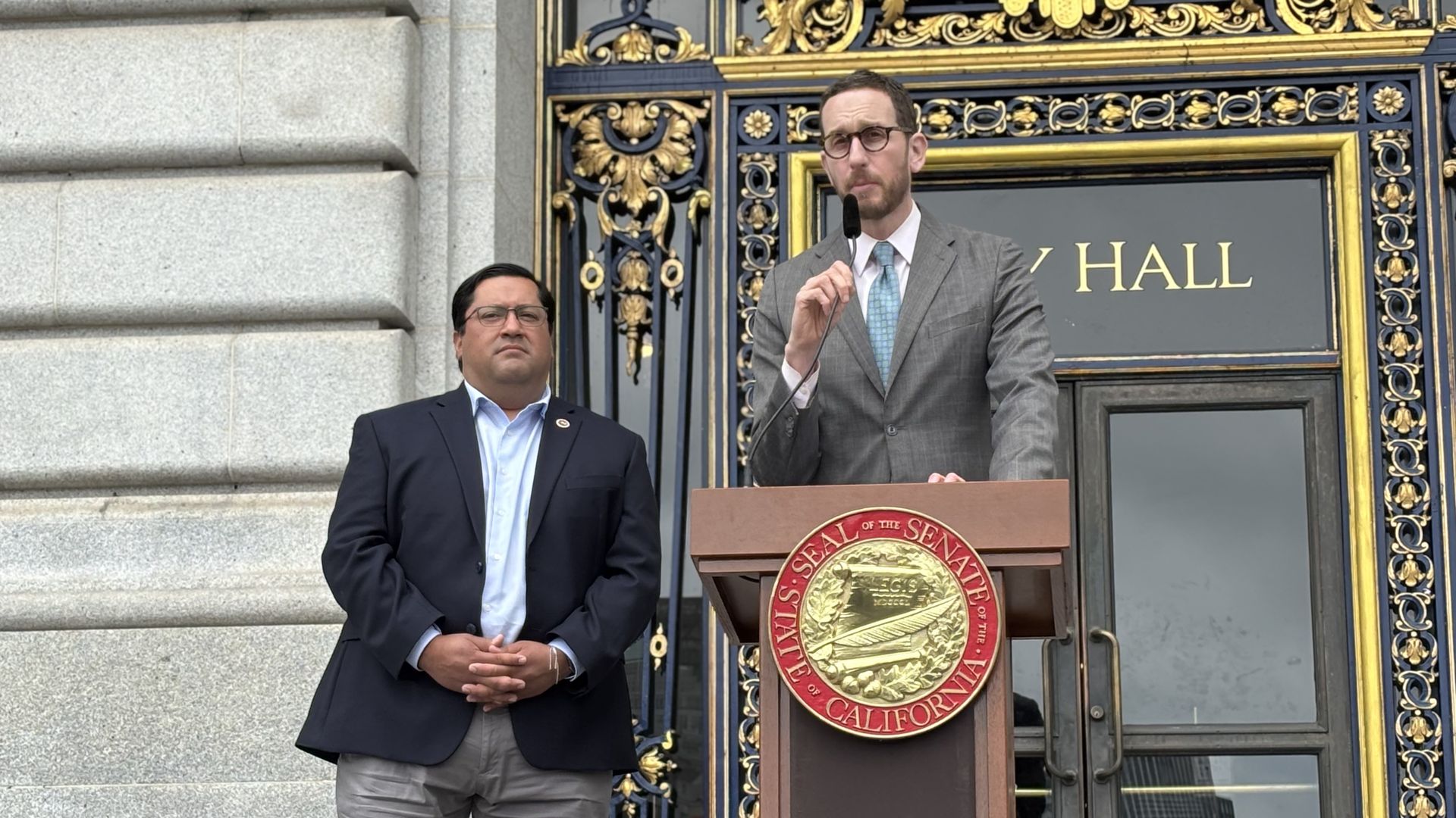 State Senators Scott Wiener and  Jesse Arreguín speak at a news conference in San Francisco.