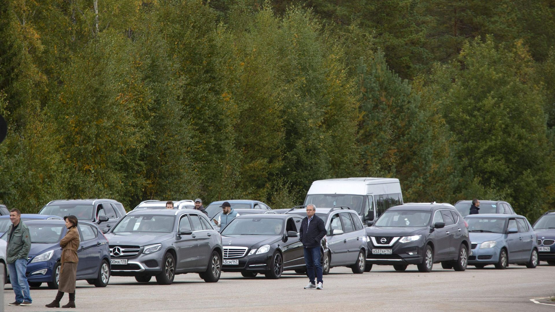 Cars coming from Russia wait in long lines