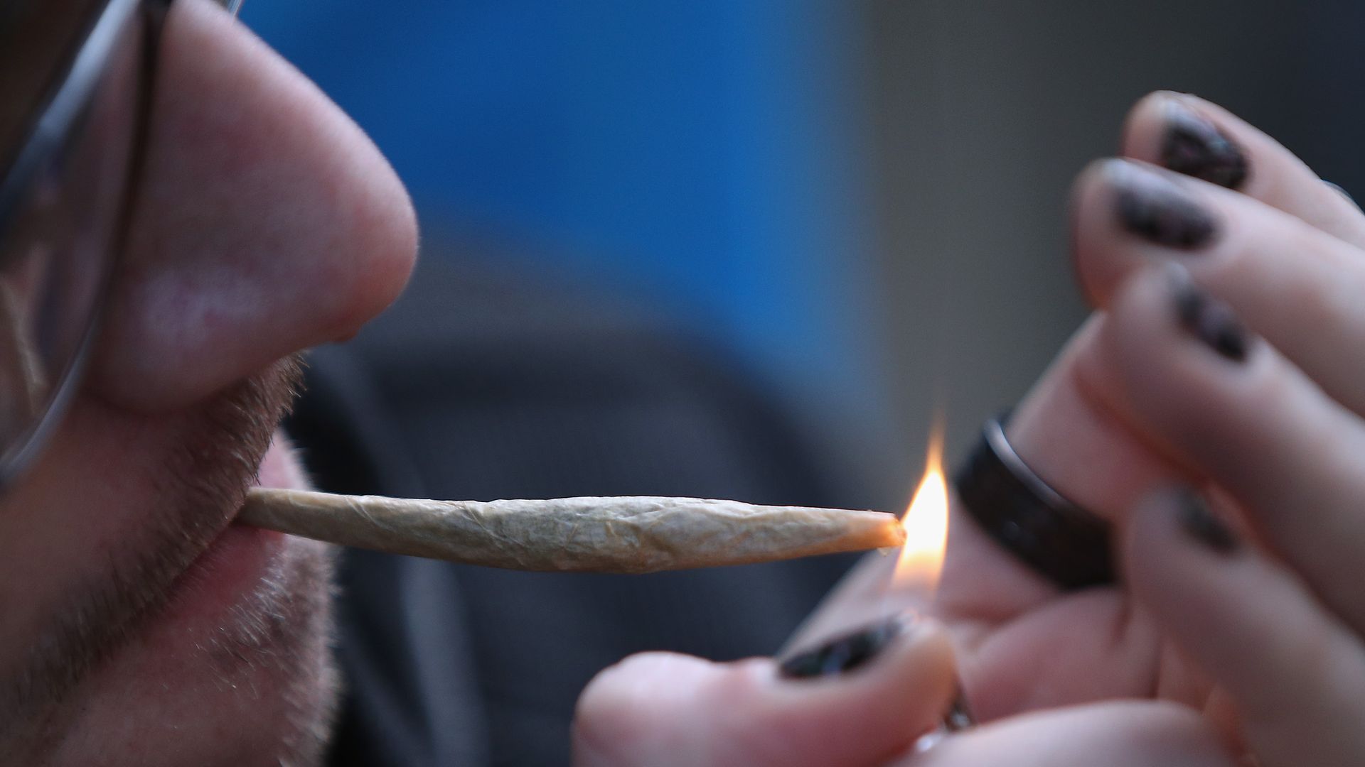 A person smokes a joint.