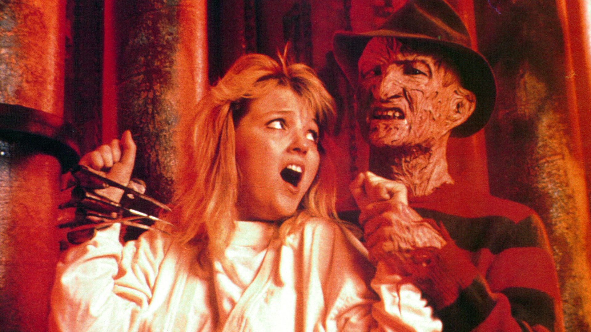 Freddy Krueger holds a young woman hostage. 