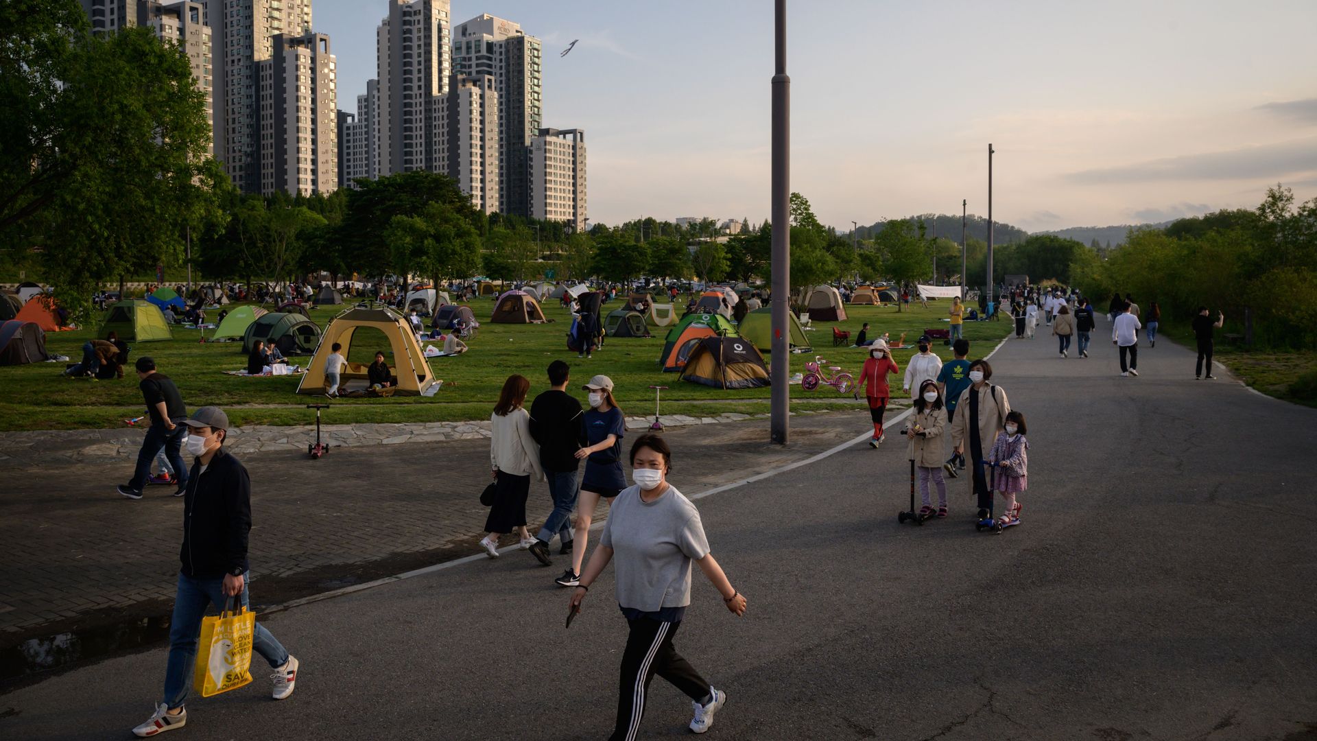 People walking through a park in Seoul on May 24.