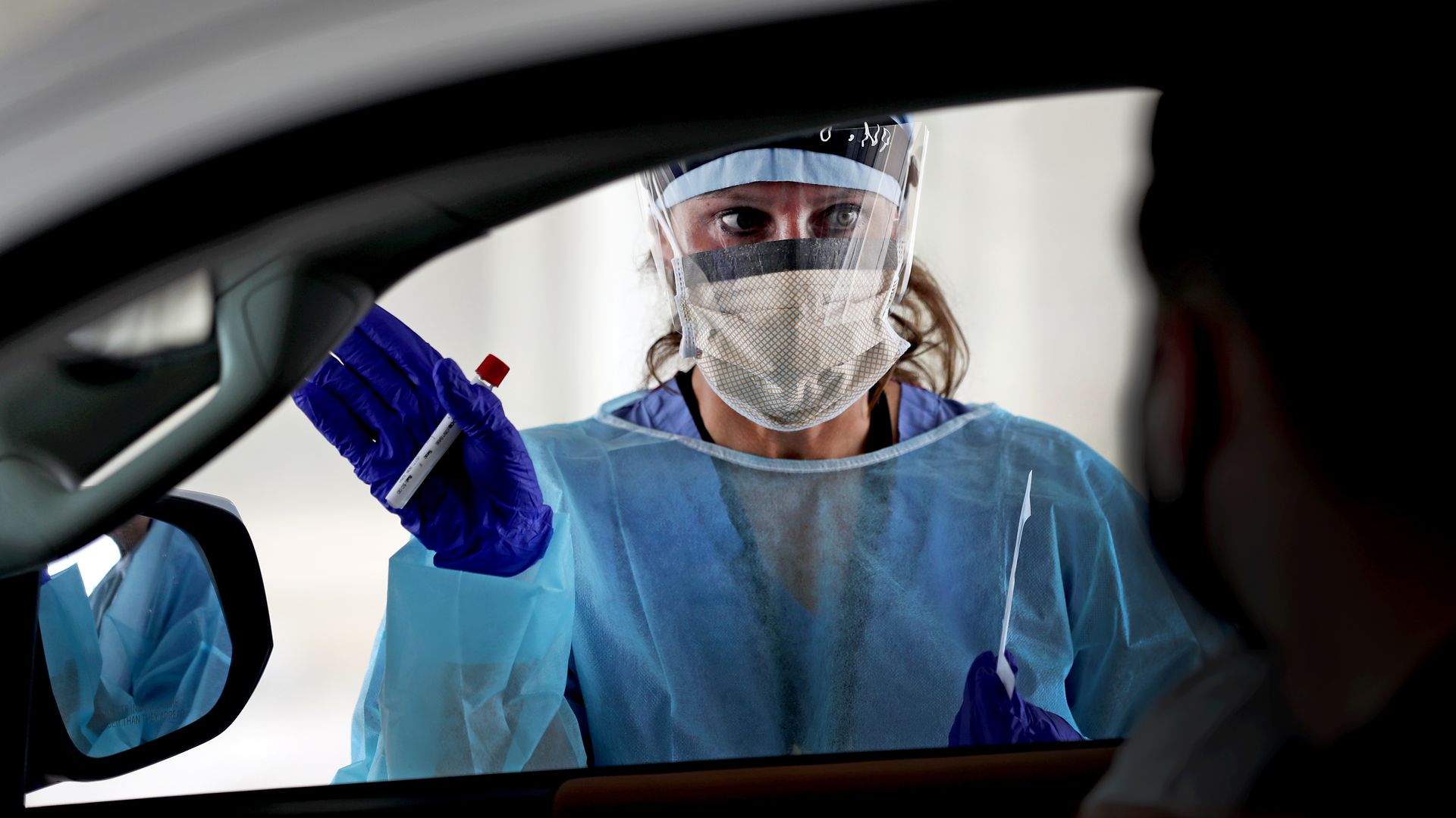 A health worker practitioner administers a coronavirus test in Brockton, Massachusetts, on on Aug. 13. 