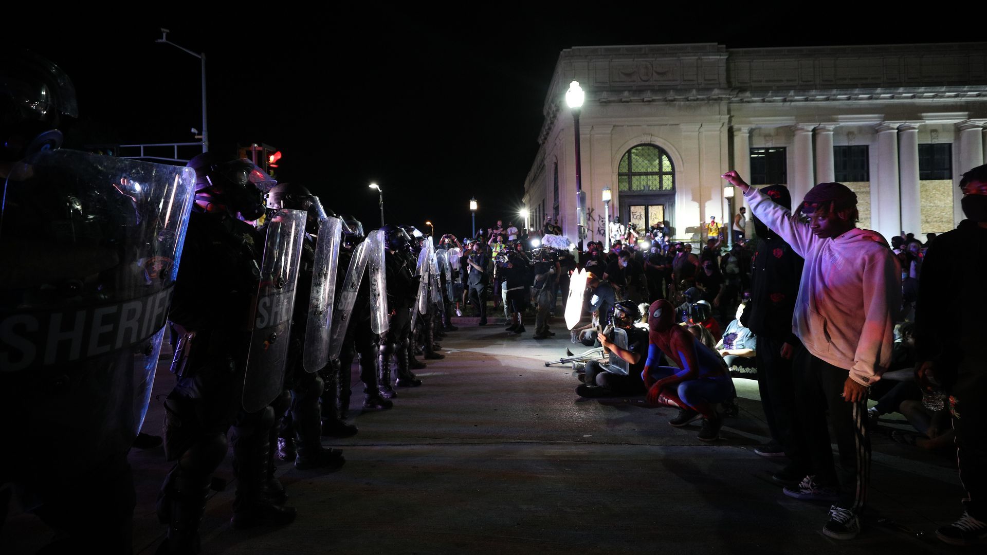 Protestors confront police in front of the Kenosha County Courthouse on August 25, 2020.