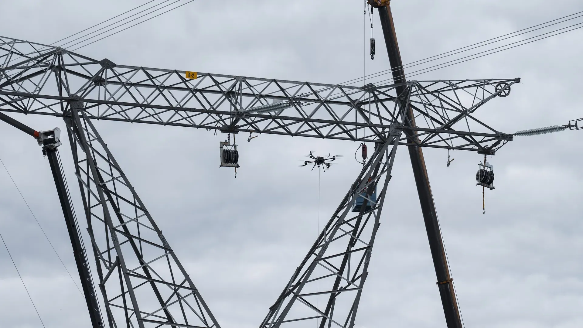 Photo of drones stringing power transmission lines.