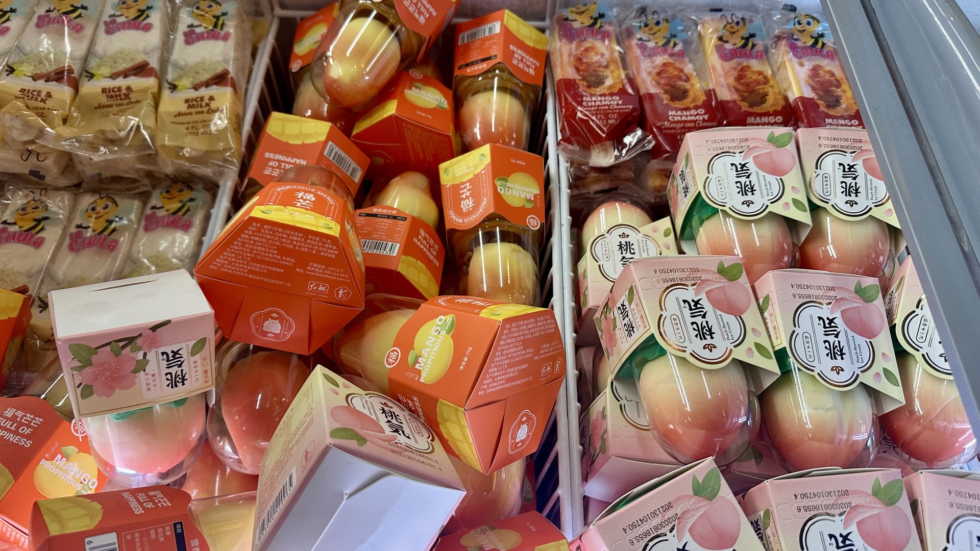 Photo shows mango and peach ice cream.