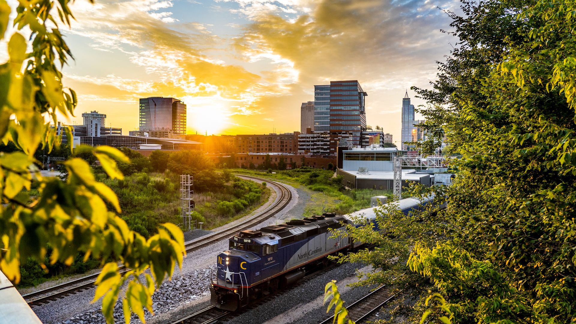 A train passes through downtown Raleigh