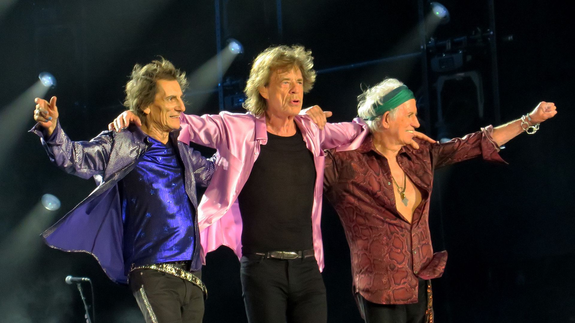 Rolling Stones members Ronnie Wood, Mick Jagger and Keith Richards perform on stage. 