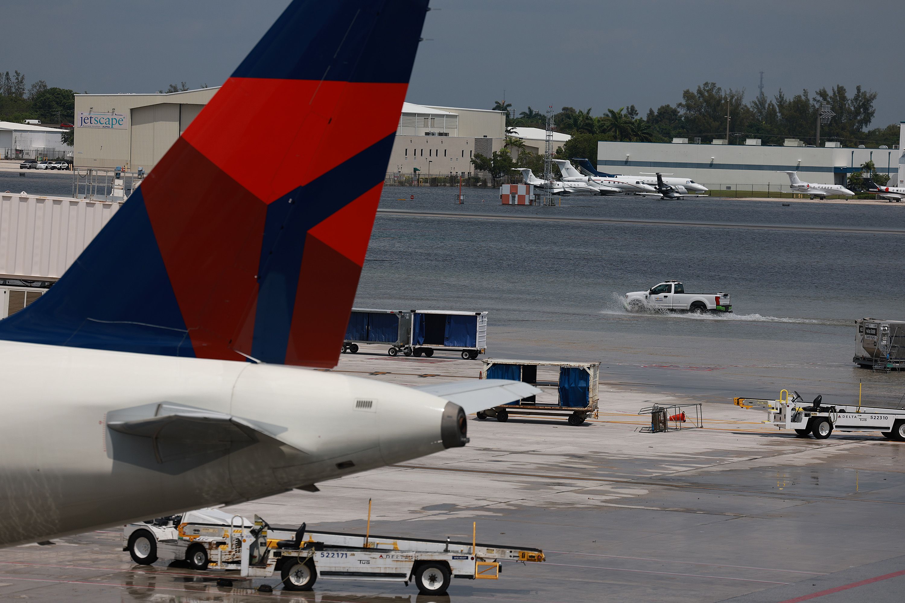 FORT LAUDERDALE, FLORIDA - APRIL 13: Planes sit at their gates after the Fort Lauderdale-Hollywood International Airport was closed due to the runways being flooded on April 13, 2023 in Fort Lauderdale, Florida. The heavy rain yesterday caused flooding as the region recorded rainfall totals of more than a foot. 