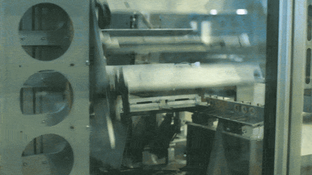 an animated GIF of a robot making a box with the Walmart logo on it