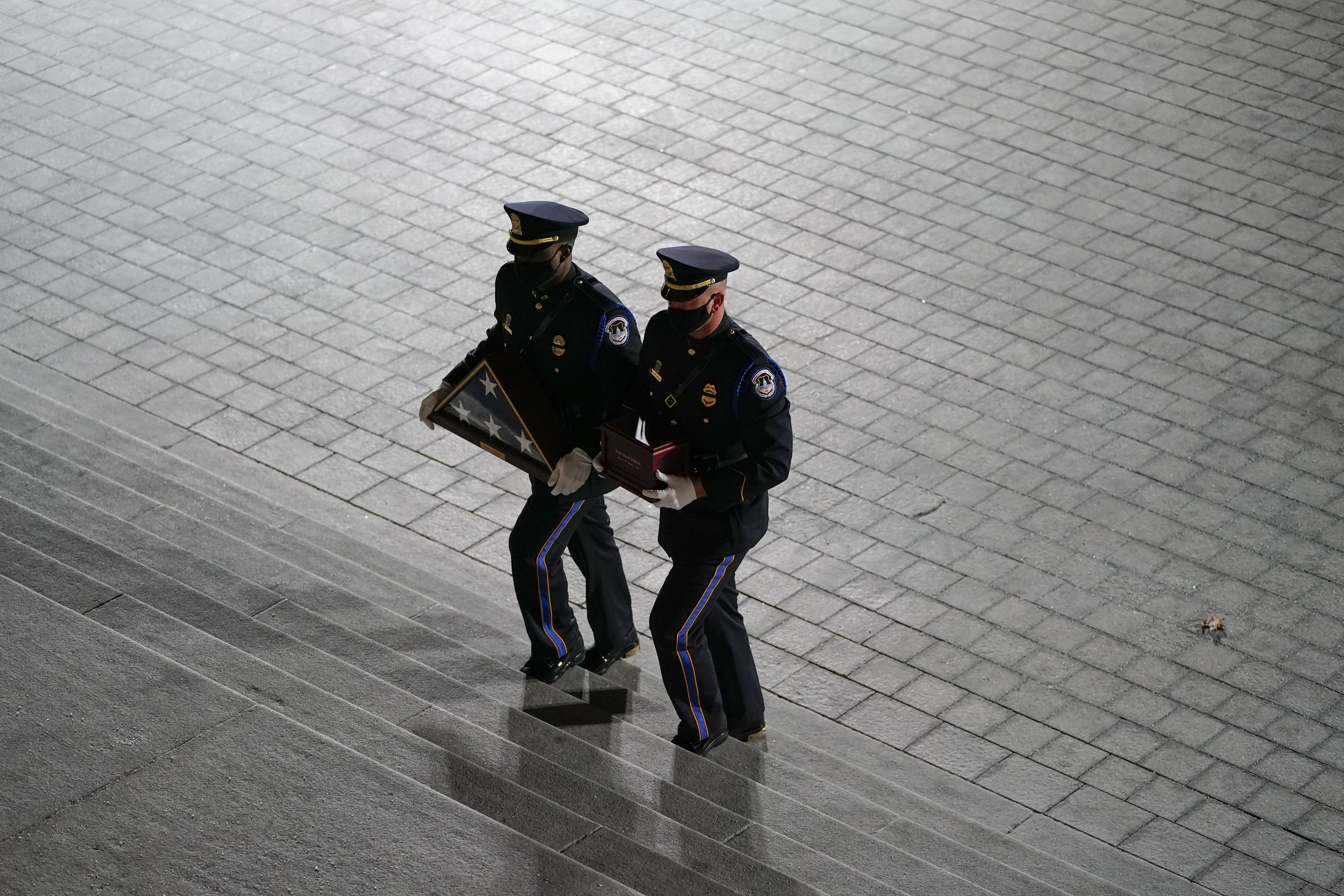 U.S. Capitol Police Officers arrive carrying the remains of U.S. Capitol Police Officer Brian Sicknick 