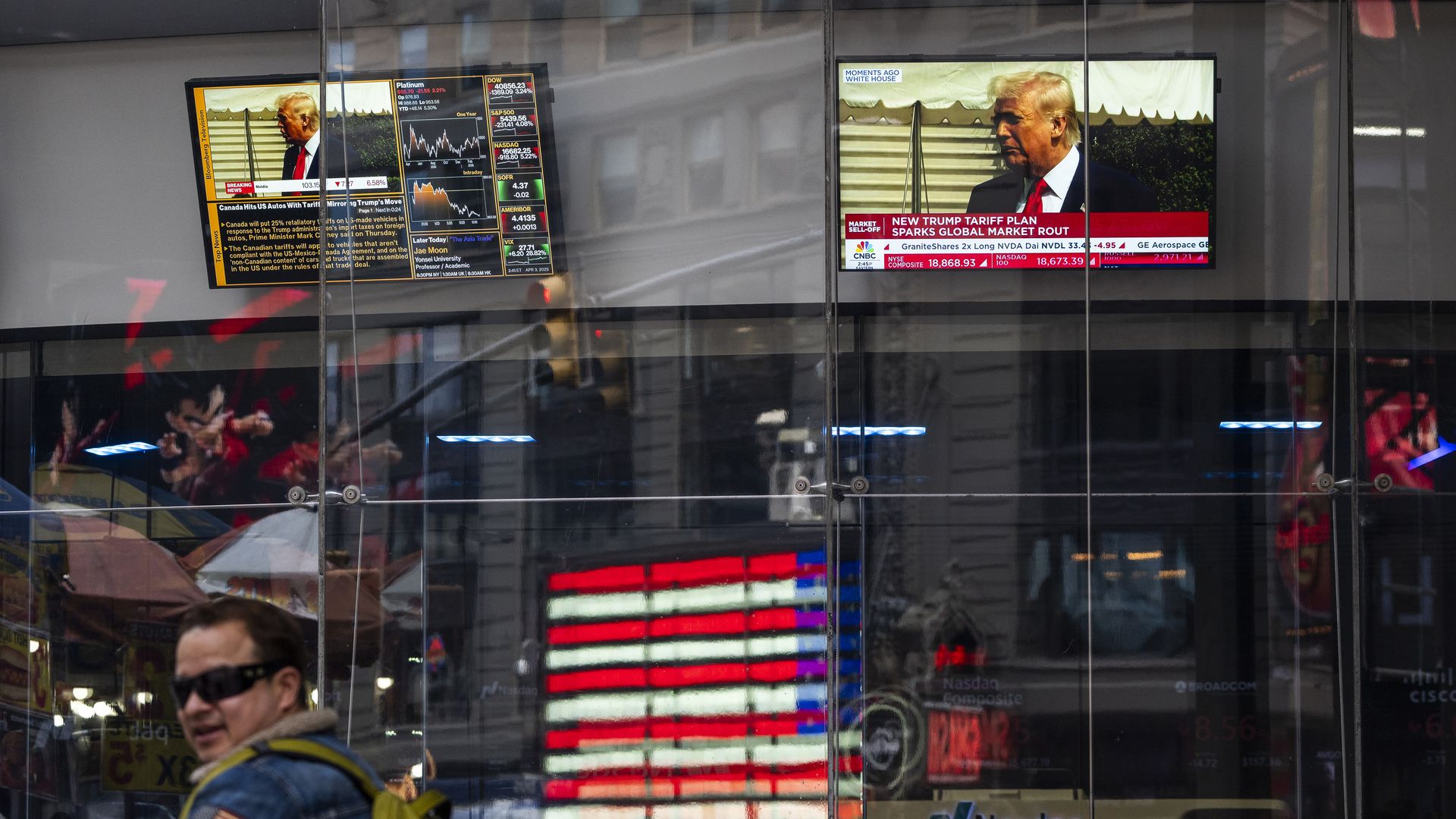 Screens shows U.S. president Donald Trump talking about Tariffs is seen at the Nasdaq's building in Times Square on April 03, 2025 in New York City. U.S. president Donald Trump's liberation day which refers to the tariff war,