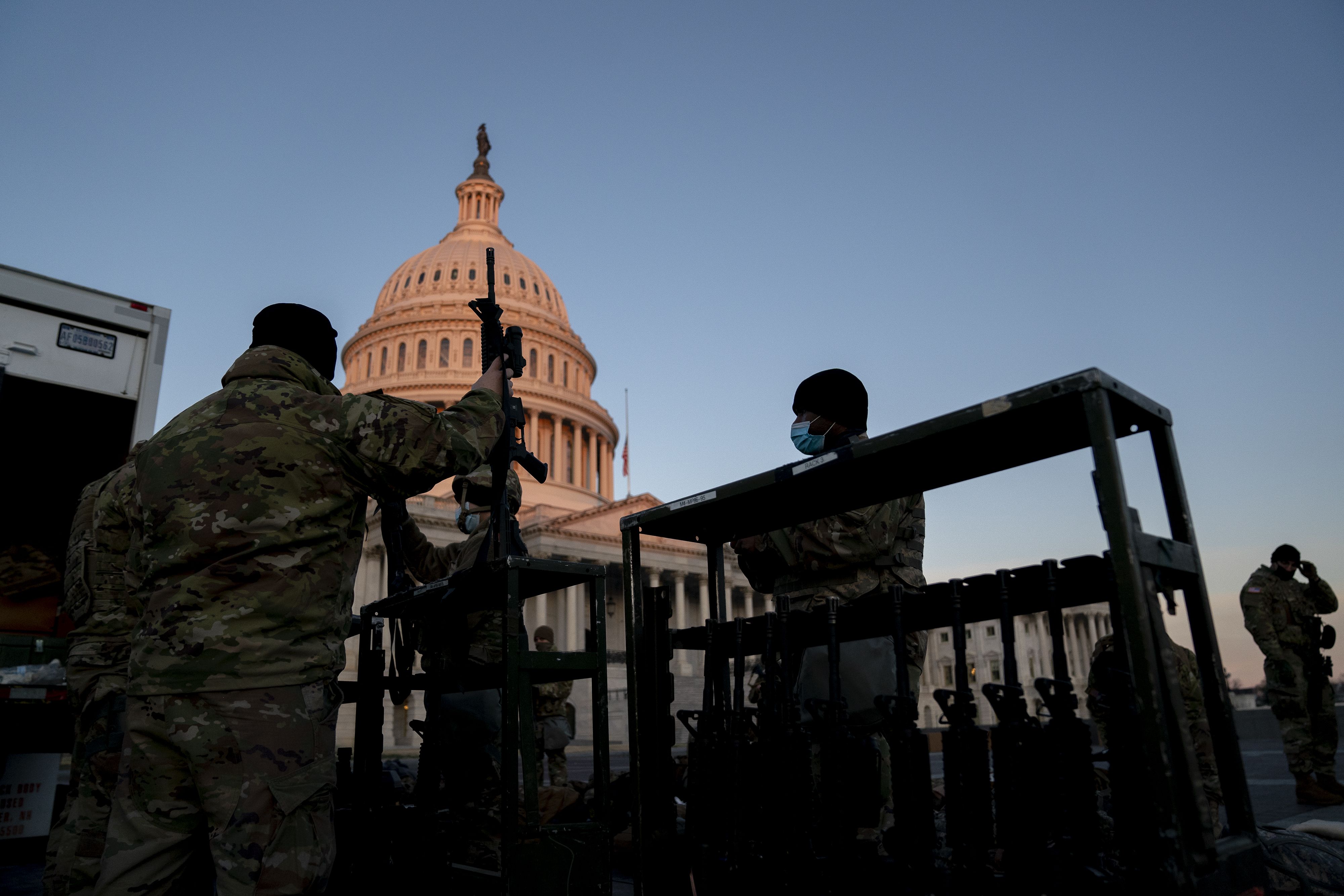 Weapons being distributed outside the Capitol. Photo: Stefani Reynolds/Getty Images