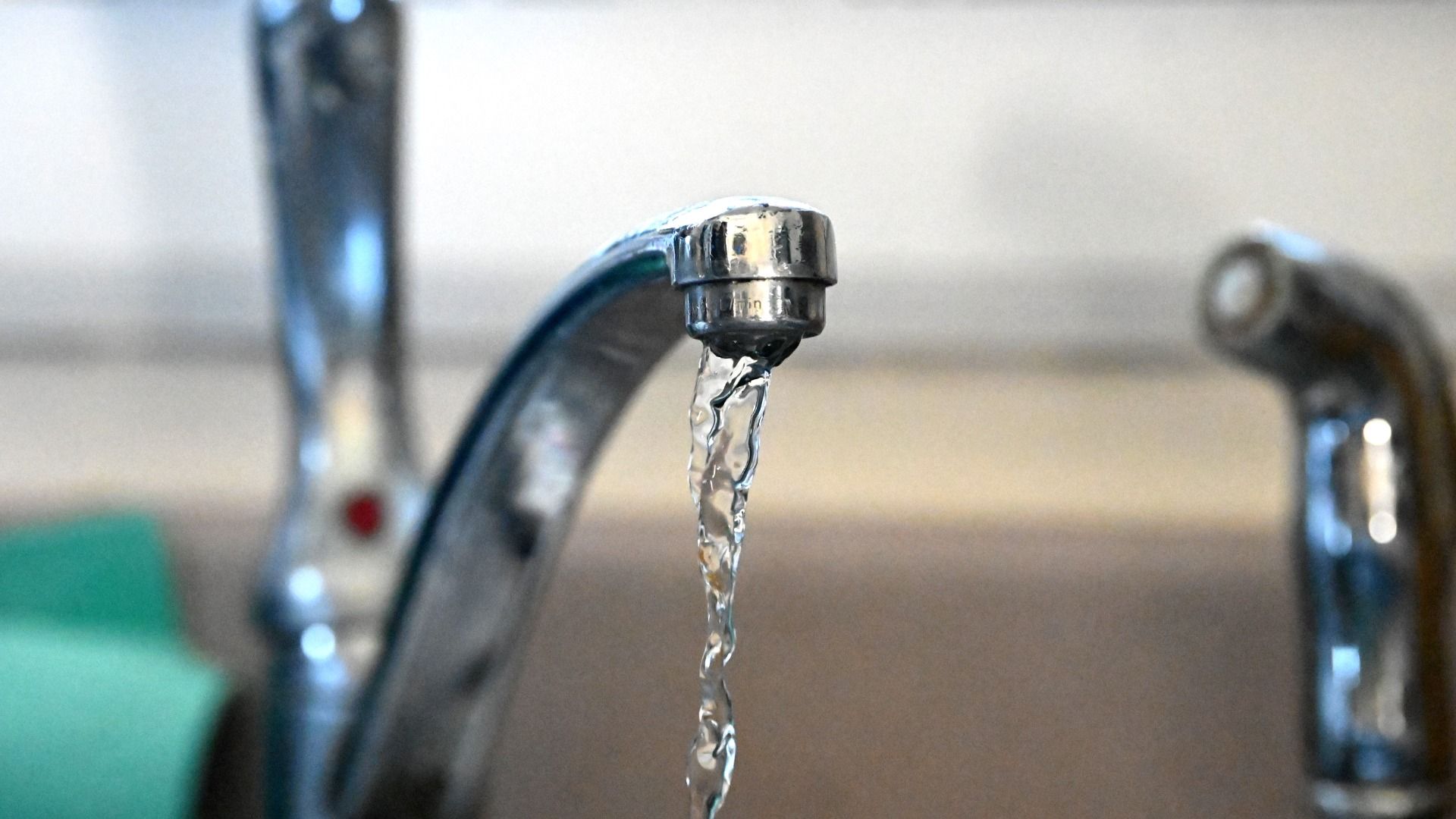 Filtered tap water flows from Bethlehem resident Jessica Dillon's kitchen faucet on Thursday, Jan. 9, 2025, in Delmar, N.Y. Dillon had a water filtration system installed to get rid of the algae smell that has plagued the town's water supply for months.