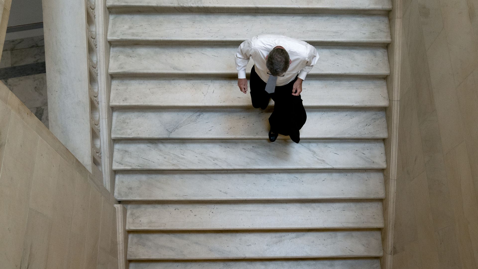 Sen. Richard Burr of North Carolina is seen walking down a set of stairs after leaving a Republican luncheon in the Russell Building.