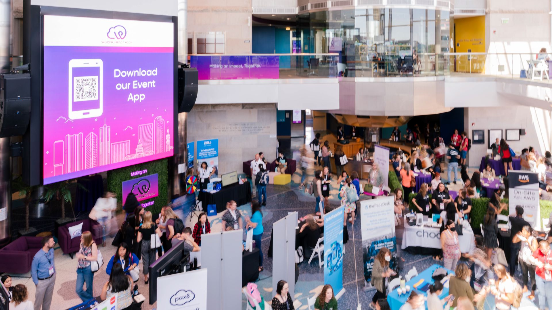 Photo of people gathering in a conference lobby