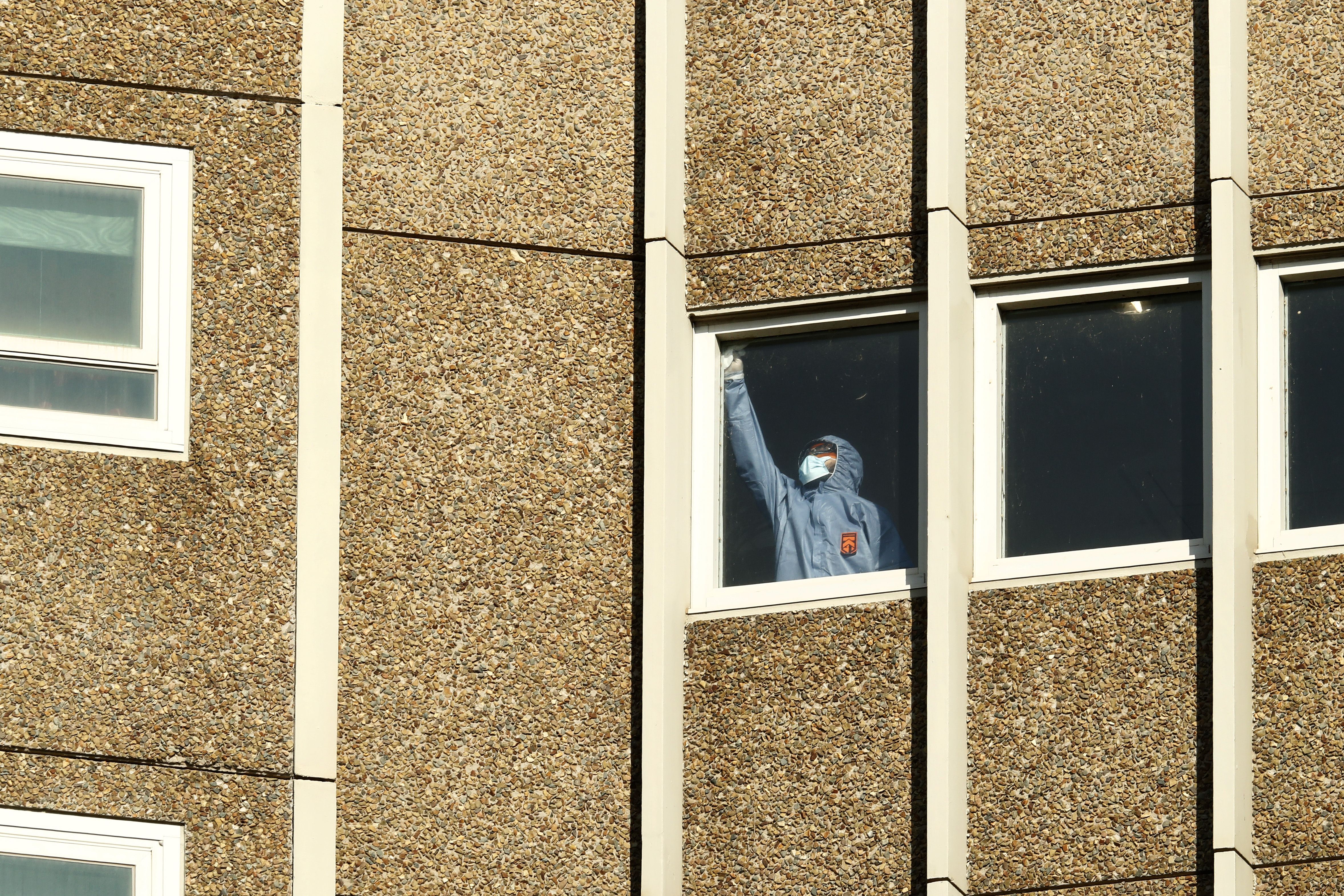 Cleaning takes place inside the Alfred Street Public Housing Complex in North Melbourne on July 17