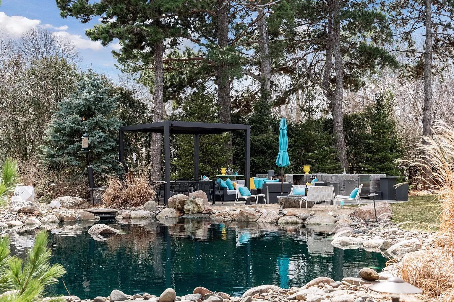 A pond with a patio.