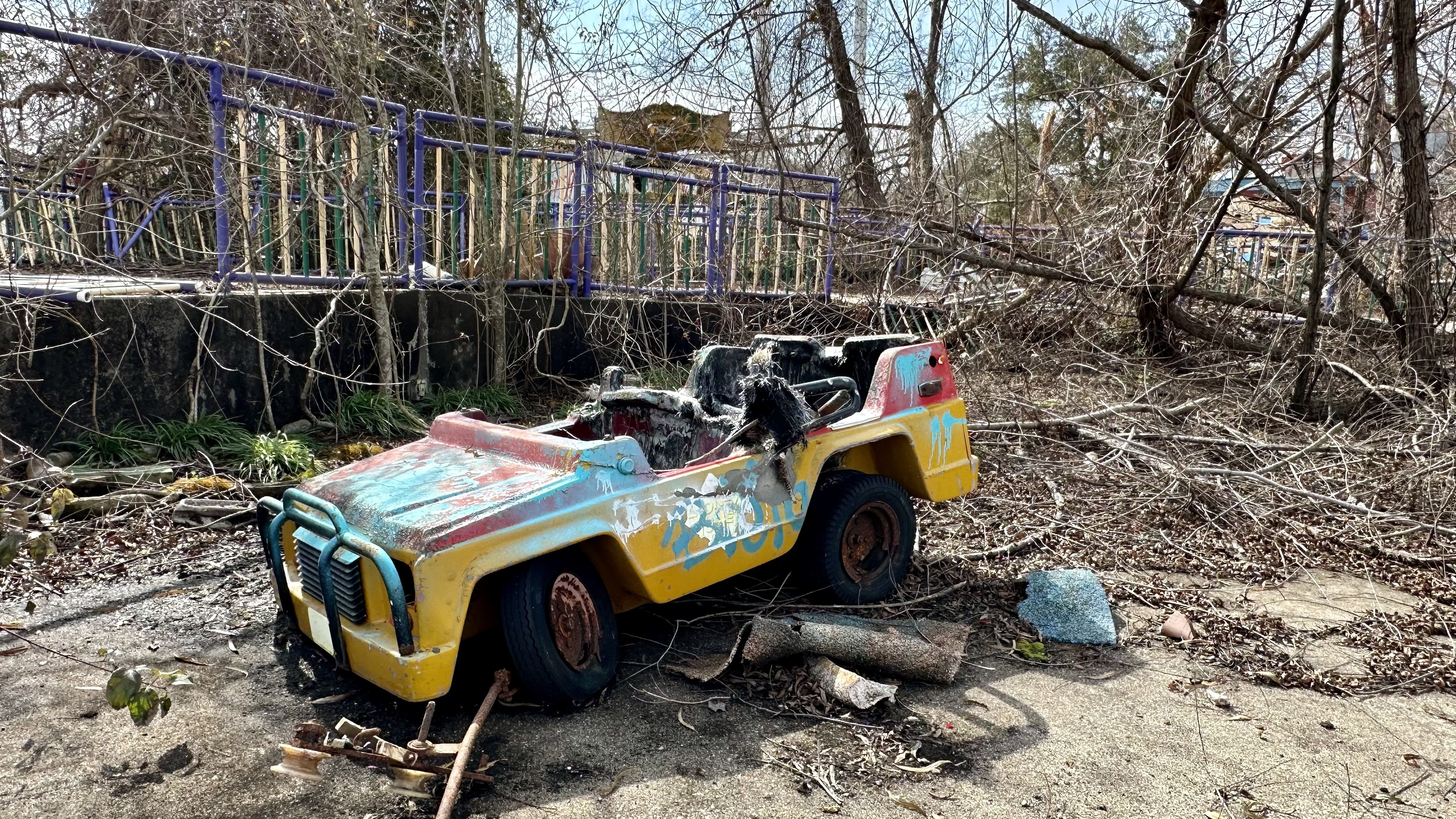 Photo shows a decrepit toy car.