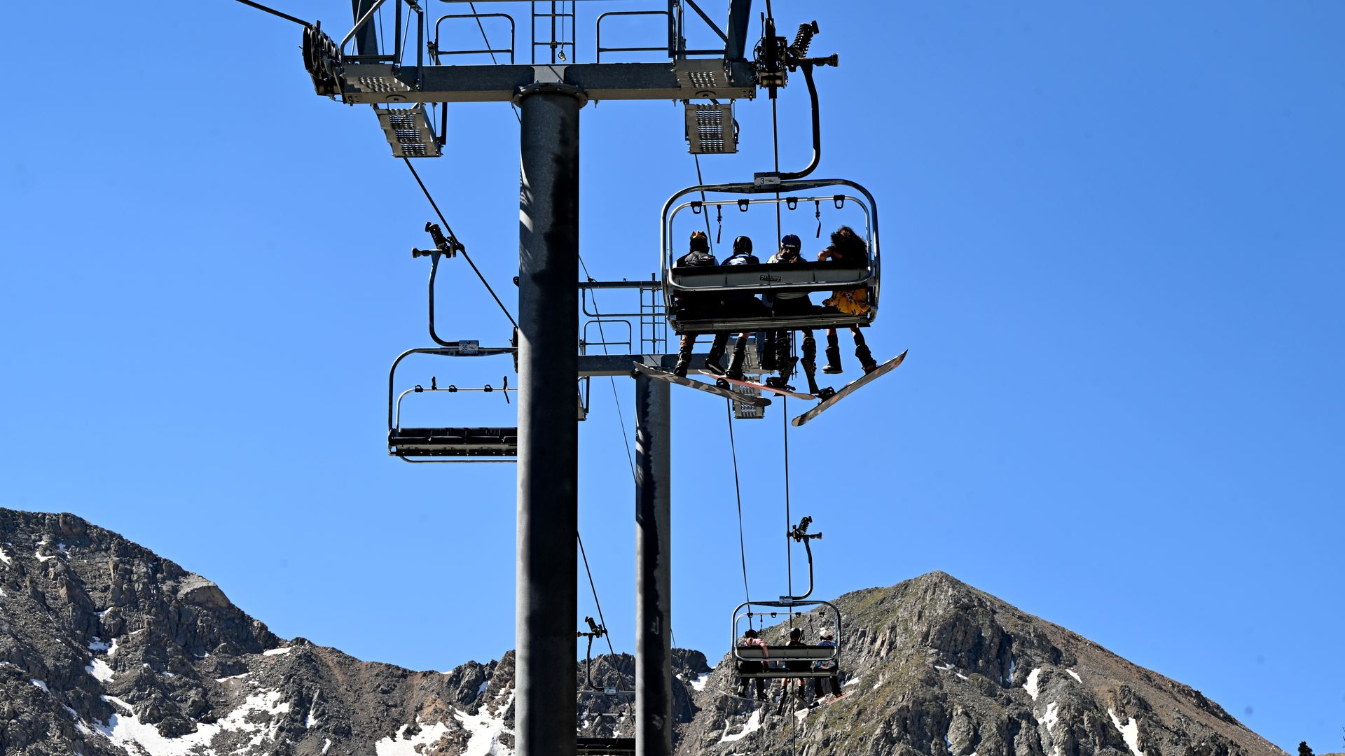 Skiers and snowboarders ride the lift up for the last day of skiing at Arapahoe Basin Ski Area on June 16, 2024. Photo: Helen H. Richardson/Denver Post via Getty Images
