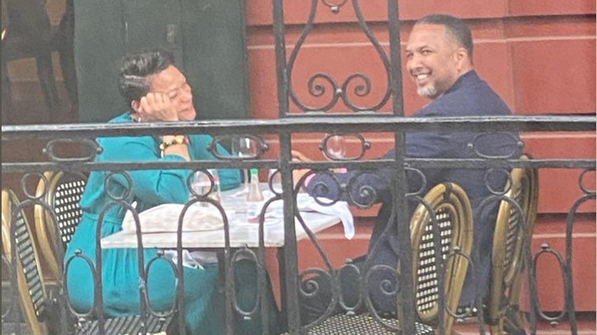 Photo shows Jeffrey Vappie and Mayor Cantrell sitting at a restaurant table on a balcony.