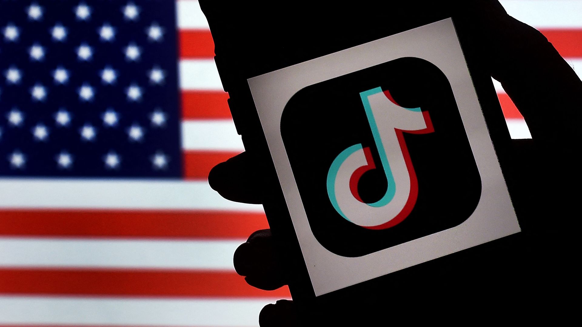 Image of the TikTok logo next to the American flag