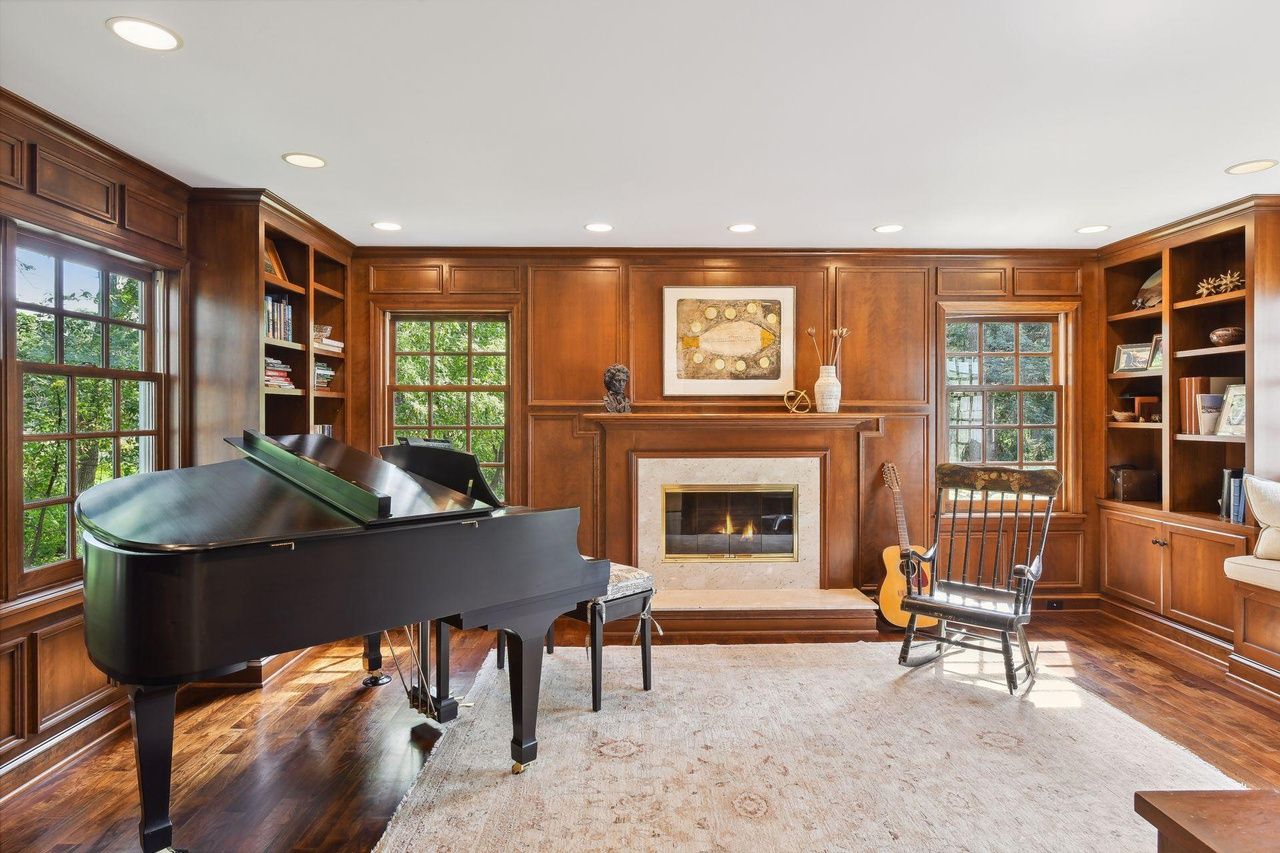 piano room with wood paneling