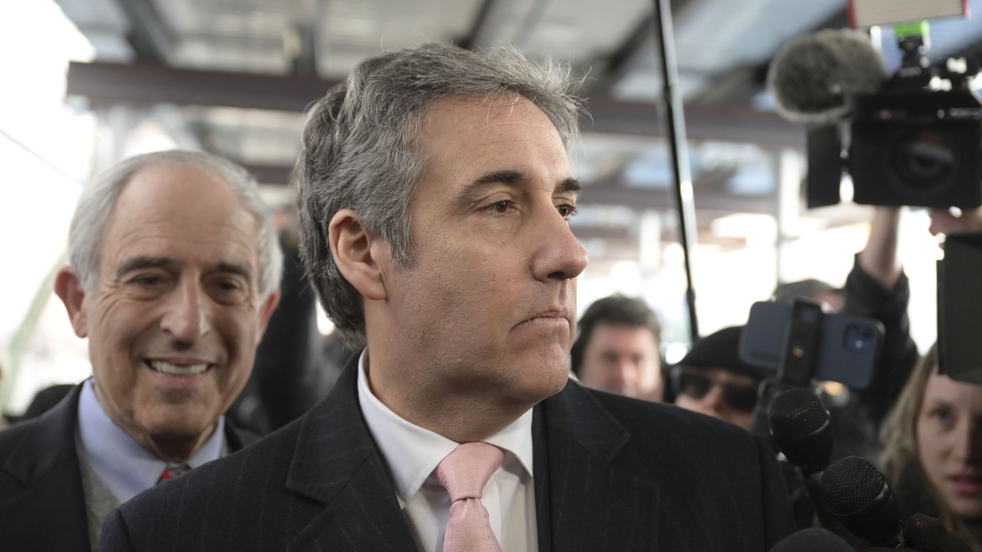 Michael Cohen, Donald Trump's former lawyer and fixer, walks out of a Manhattan courthouse.