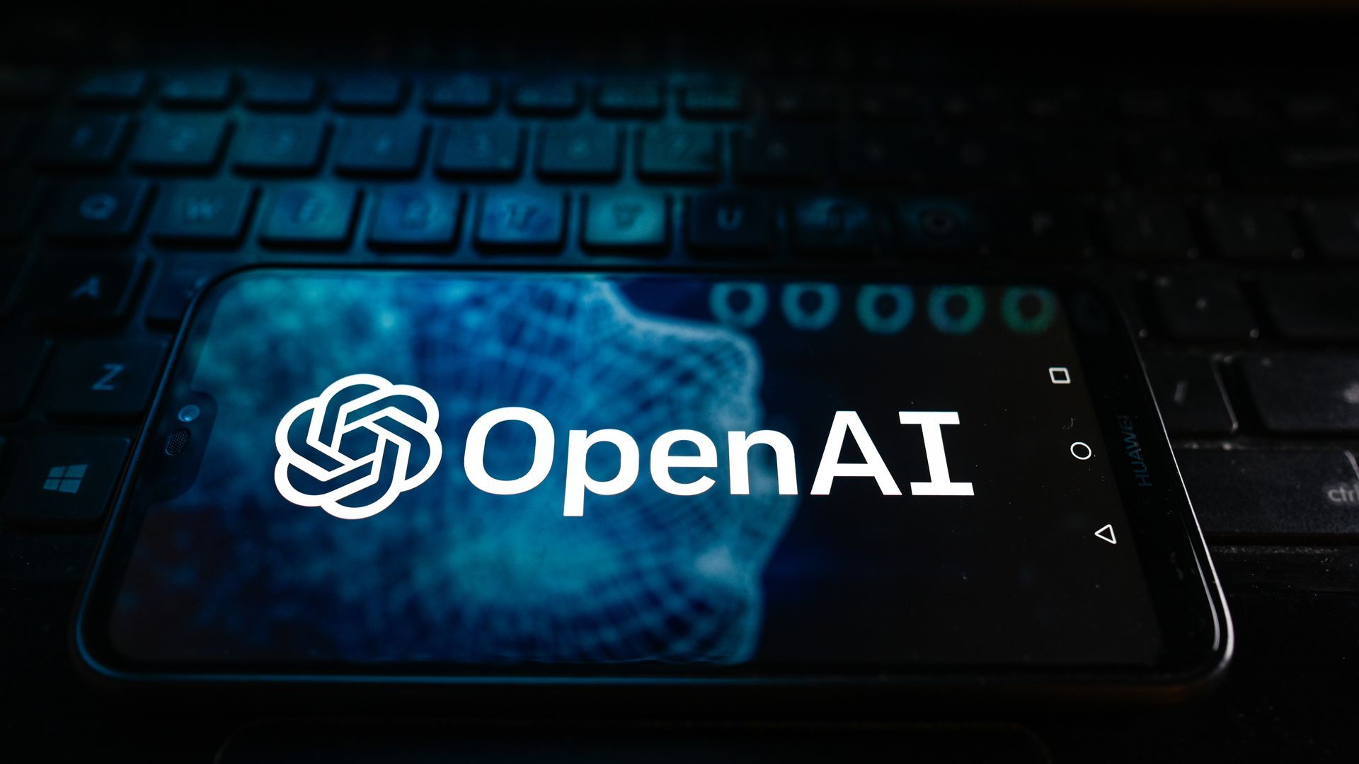 A photo illustration of the Open AI logo on a smartphone screen