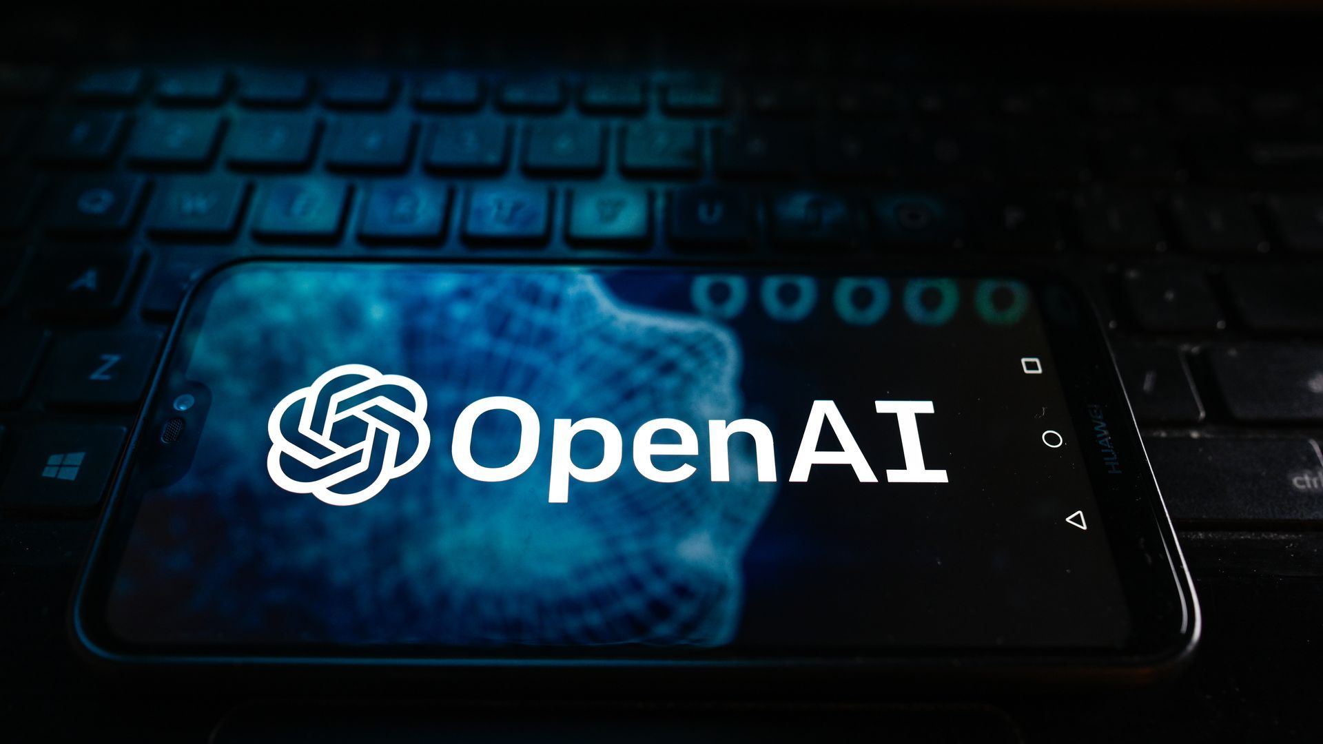A photo illustration of the Open AI logo on a smartphone screen