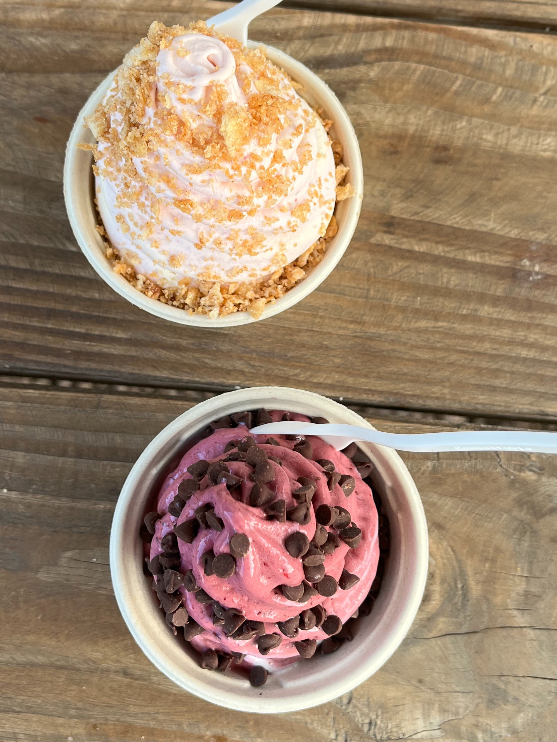 Two ice cream cups on a table