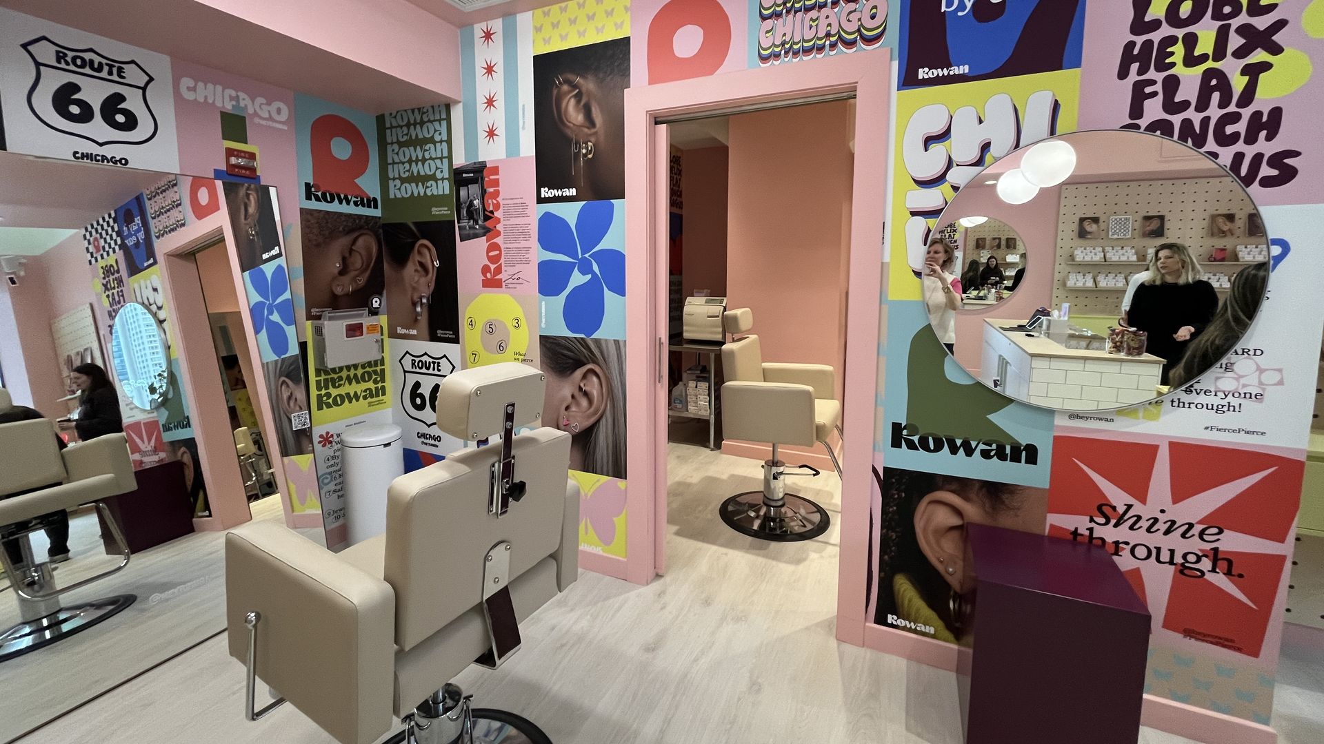 Decorated pink walls with two salon-style chairs.