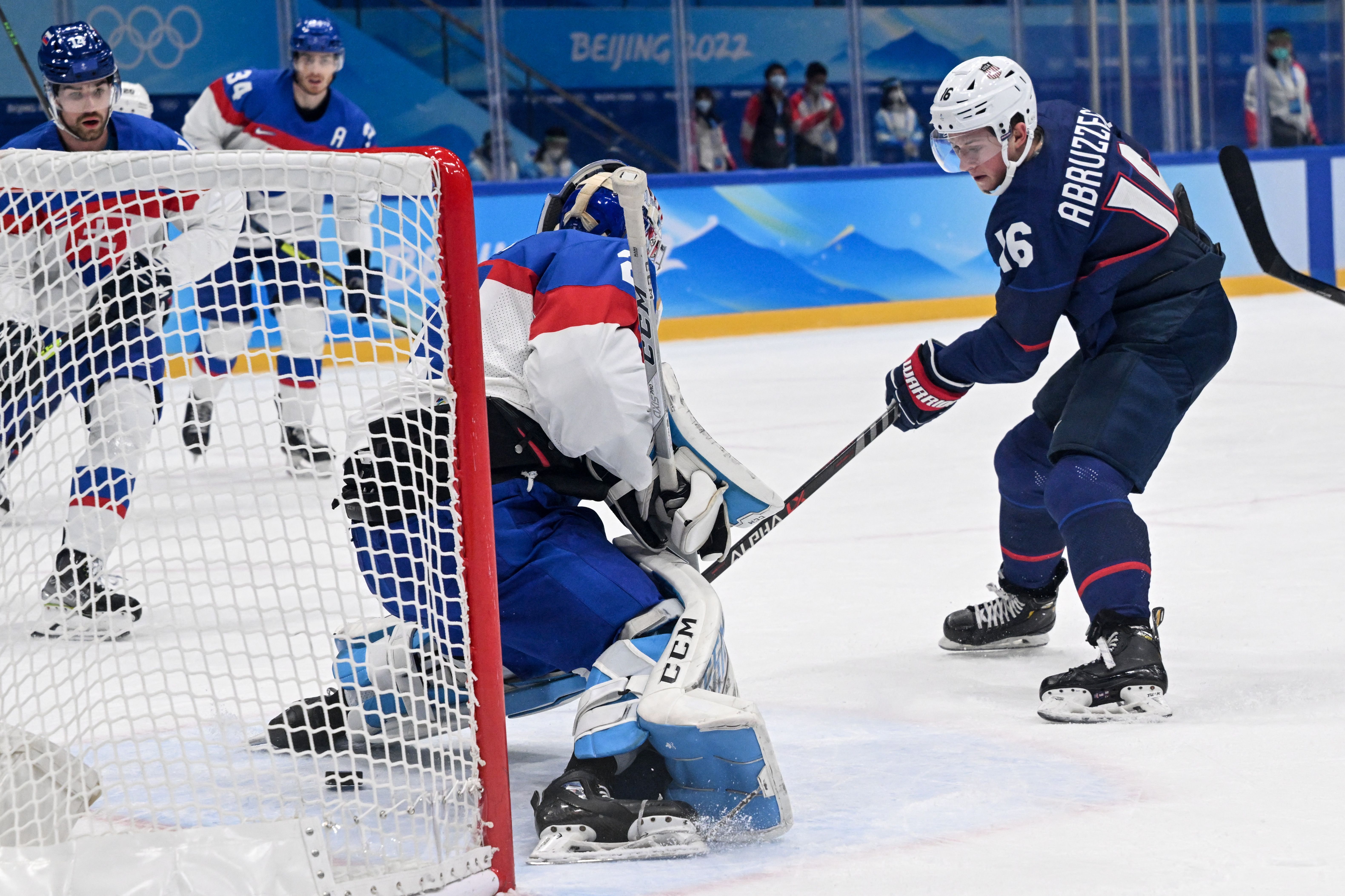 USA's Nick Abruzzese scores a goal during the men's play-off quarterfinal match of the Beijing 2022 Winter Olympic Games ice hockey competition on February 16.