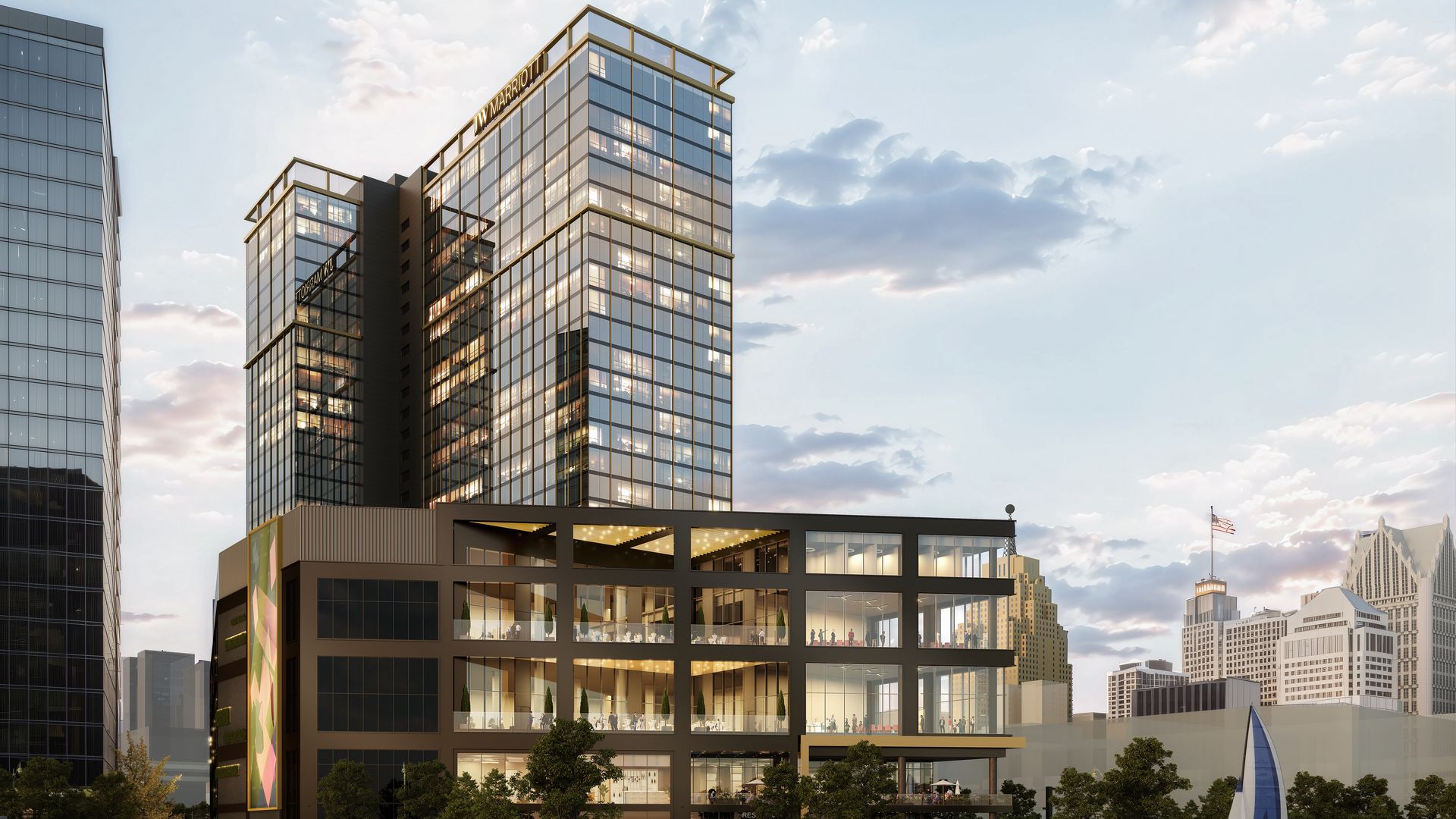 Tall waterfront tower sitting on the river. Building is made of glass and steel