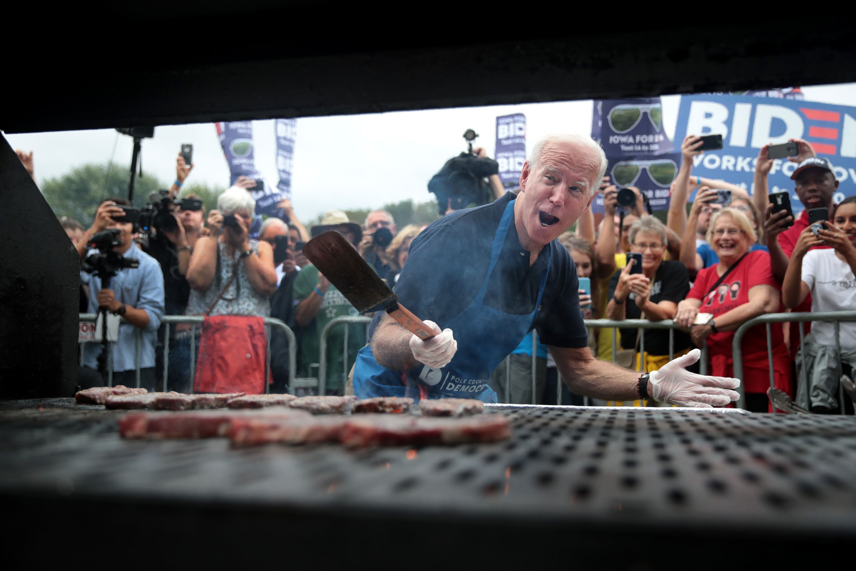 Democratic presidential candidate, former Vice President Joe Biden works the grill at the Polk County Democrats' Steak Fry on September 21