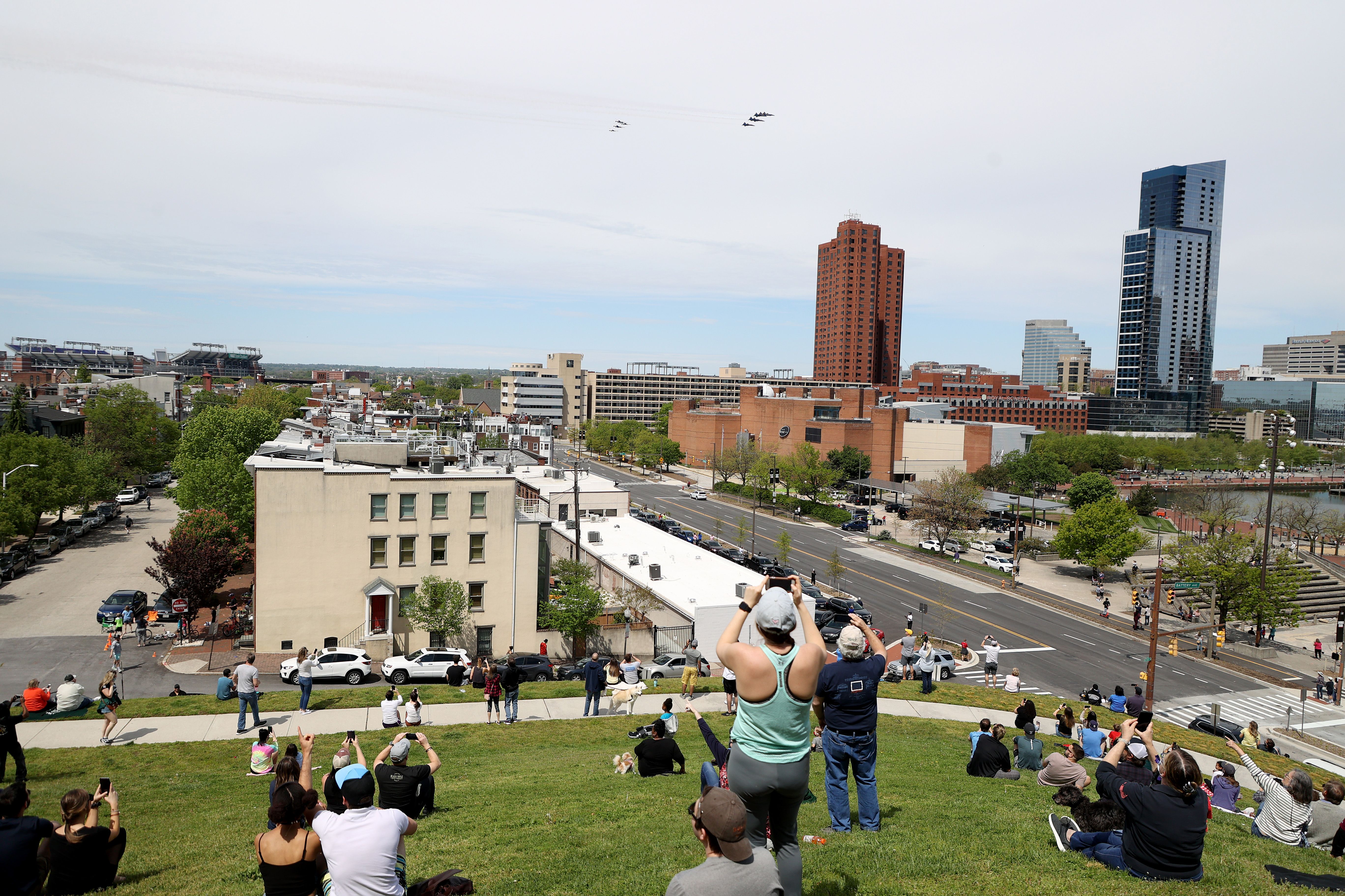 In this image, people lay on a hill while waiting for the Blue Angels to fly over.