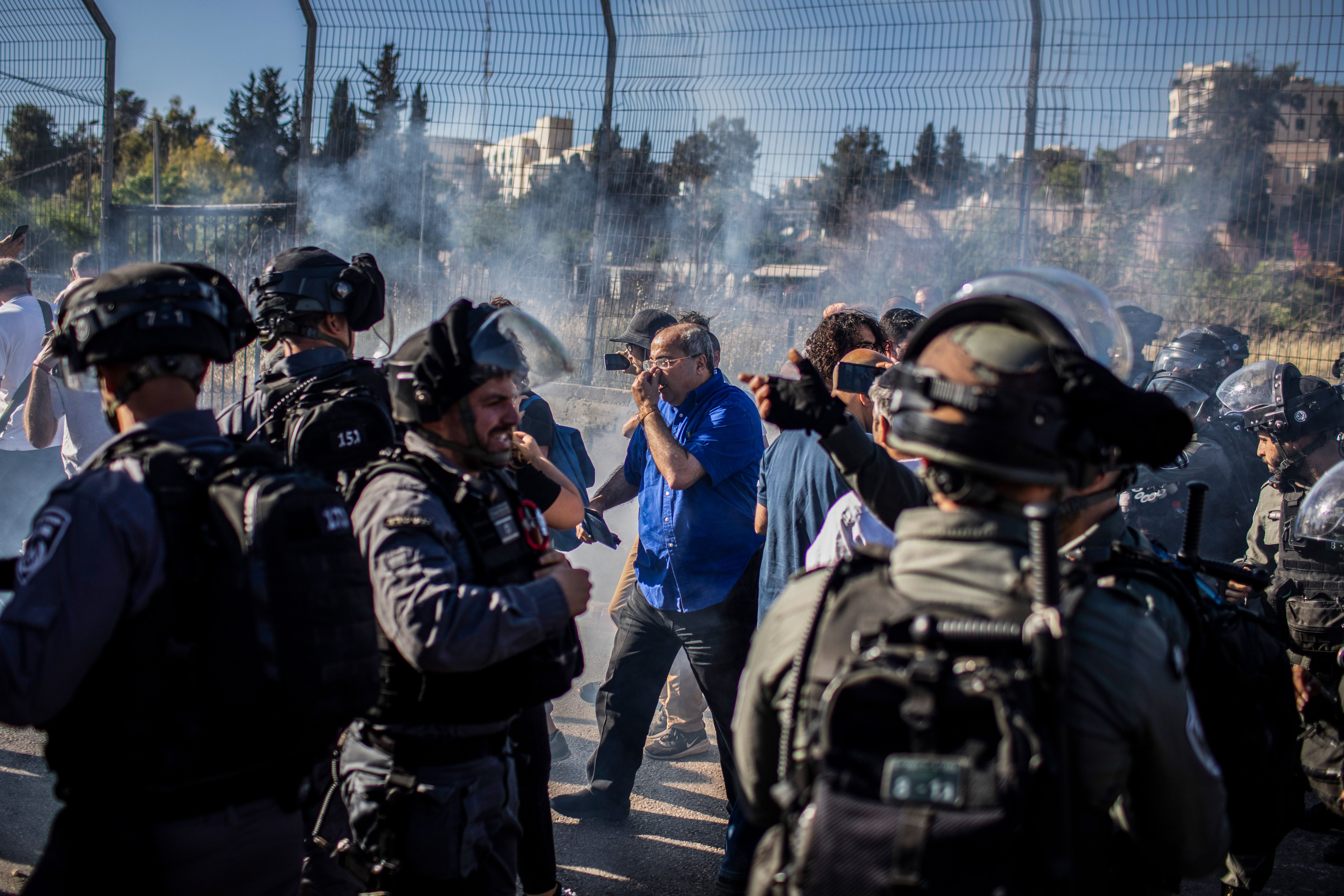 Israeli security forces use tear gas to disperse protesters during a demonstration against the planned evictions process in the Sheikh Jarrah neighbourhood