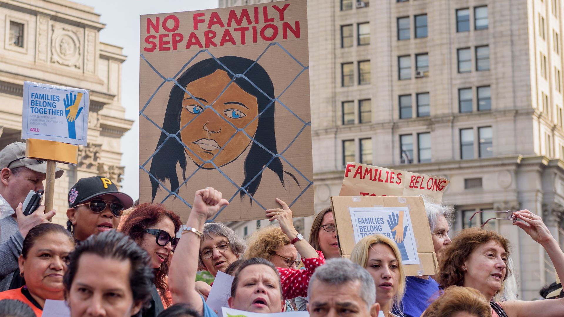 Protests against the separation of family immigrants. People holding signs that say "no family separation"