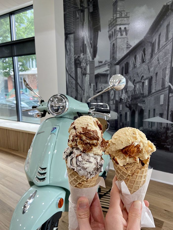 Tutti Gelato gelato in a cone in front of a vespa.