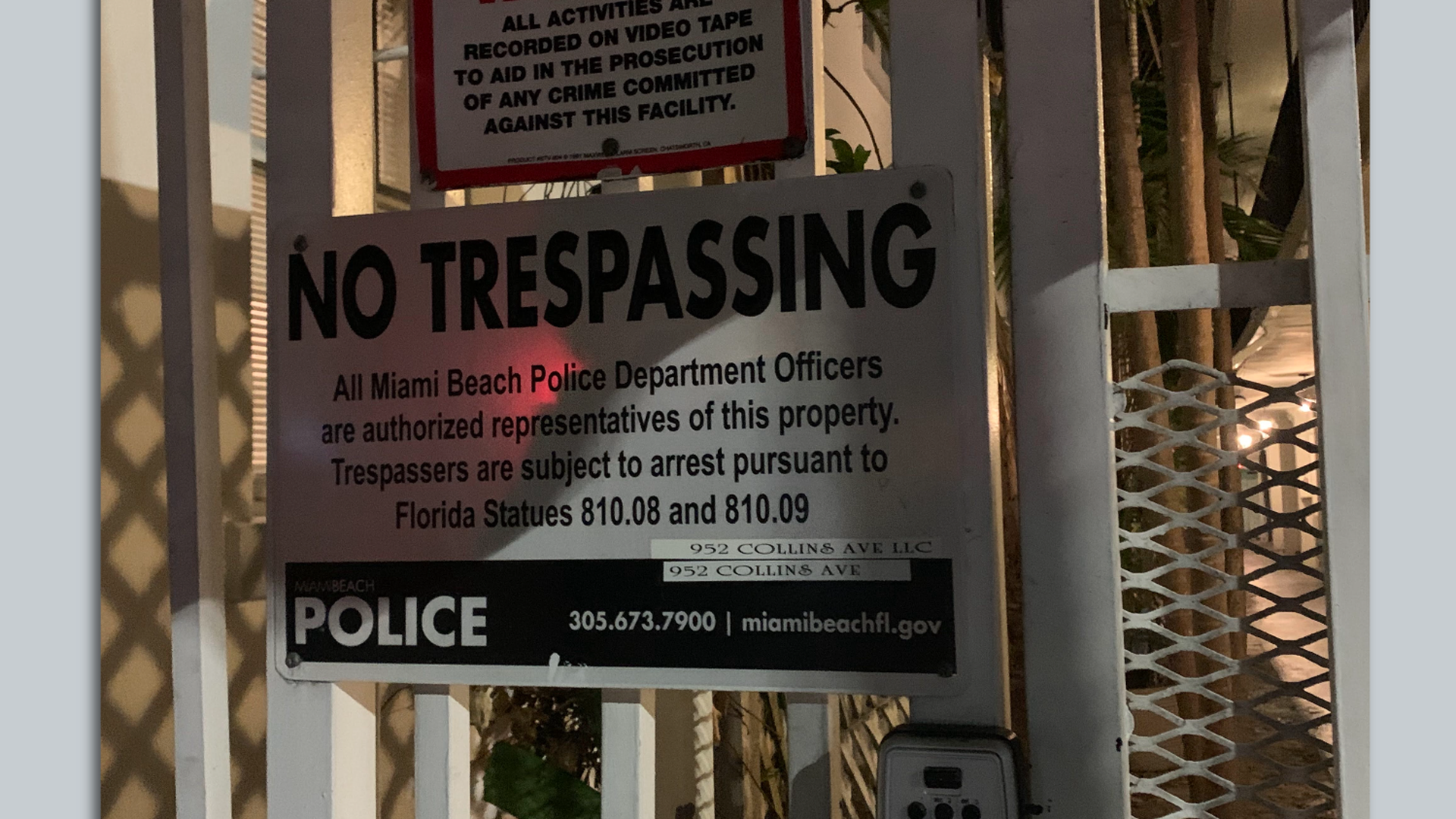 A "No Trespassing" sign with a minor typo reading "Florida Statues" instead of "Statutes" is pictured in Miami Beach.
