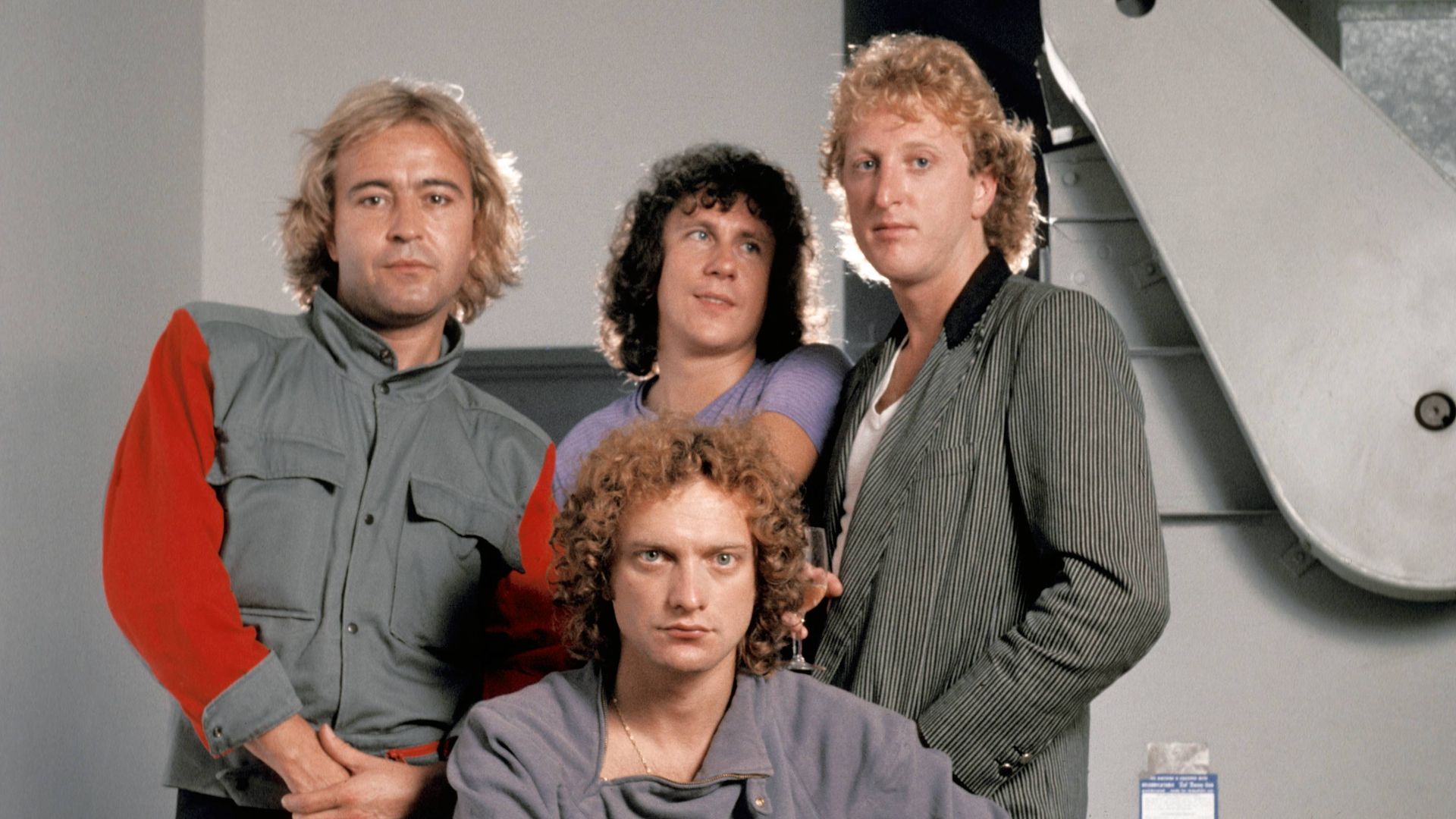 The members of 1980s band Foreigner pose for a picture. 