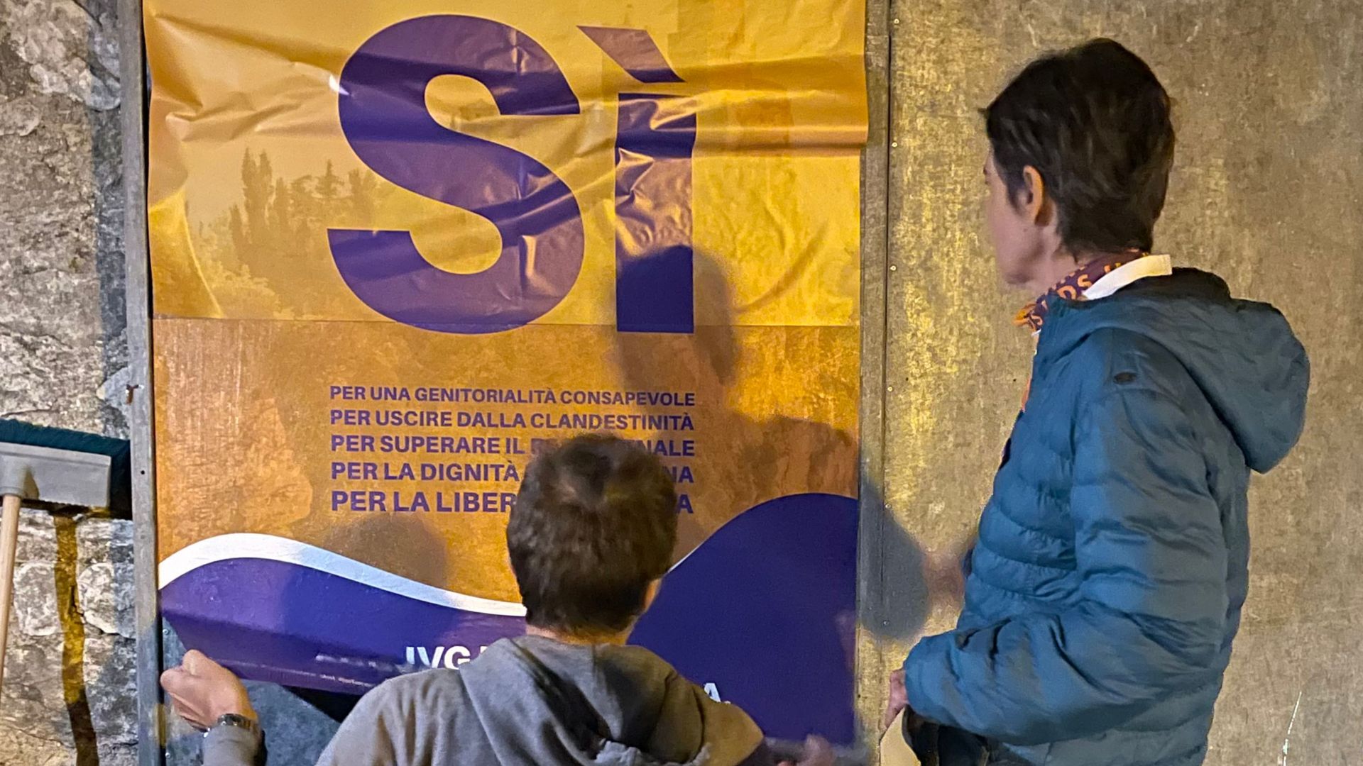 Pro-abortion activists put up posters at the start of the campaign on September 9, 2021 in San Marino