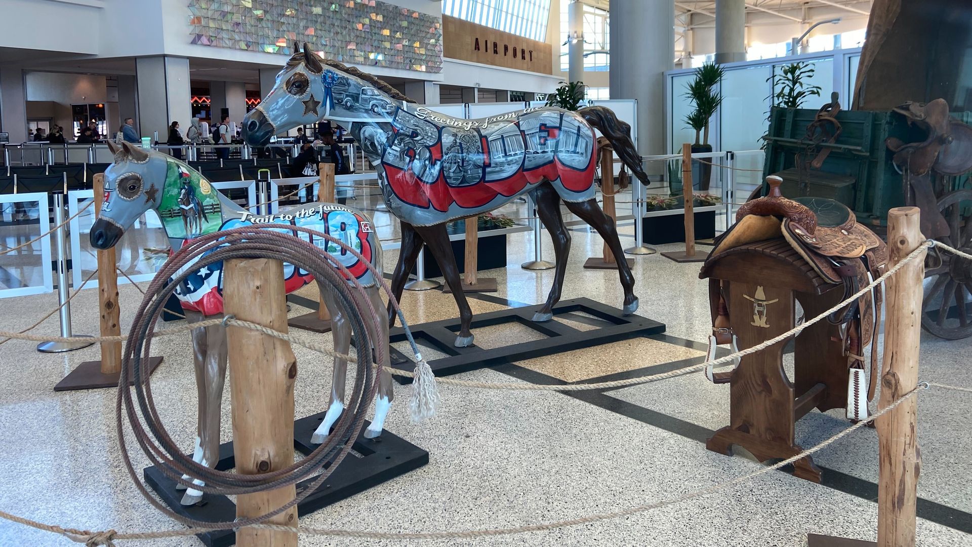 Artwork installation at Houston's Hobby Airport depicting horses, saddles and ropes dedicated to the Houston Livestock Show and Rodeo
