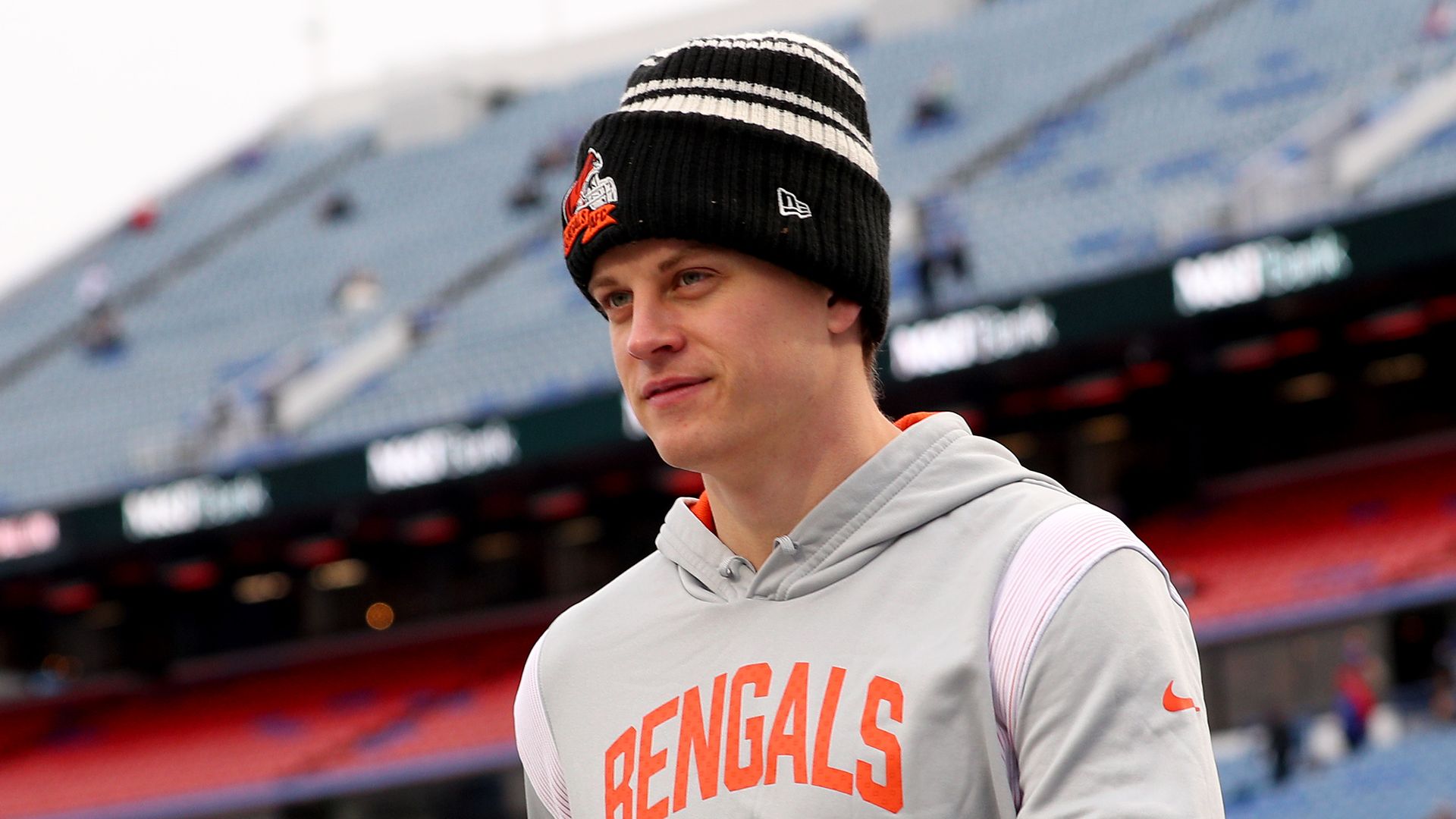 Joe Burrow in a Bengals hoodie before an NFL playoff game.