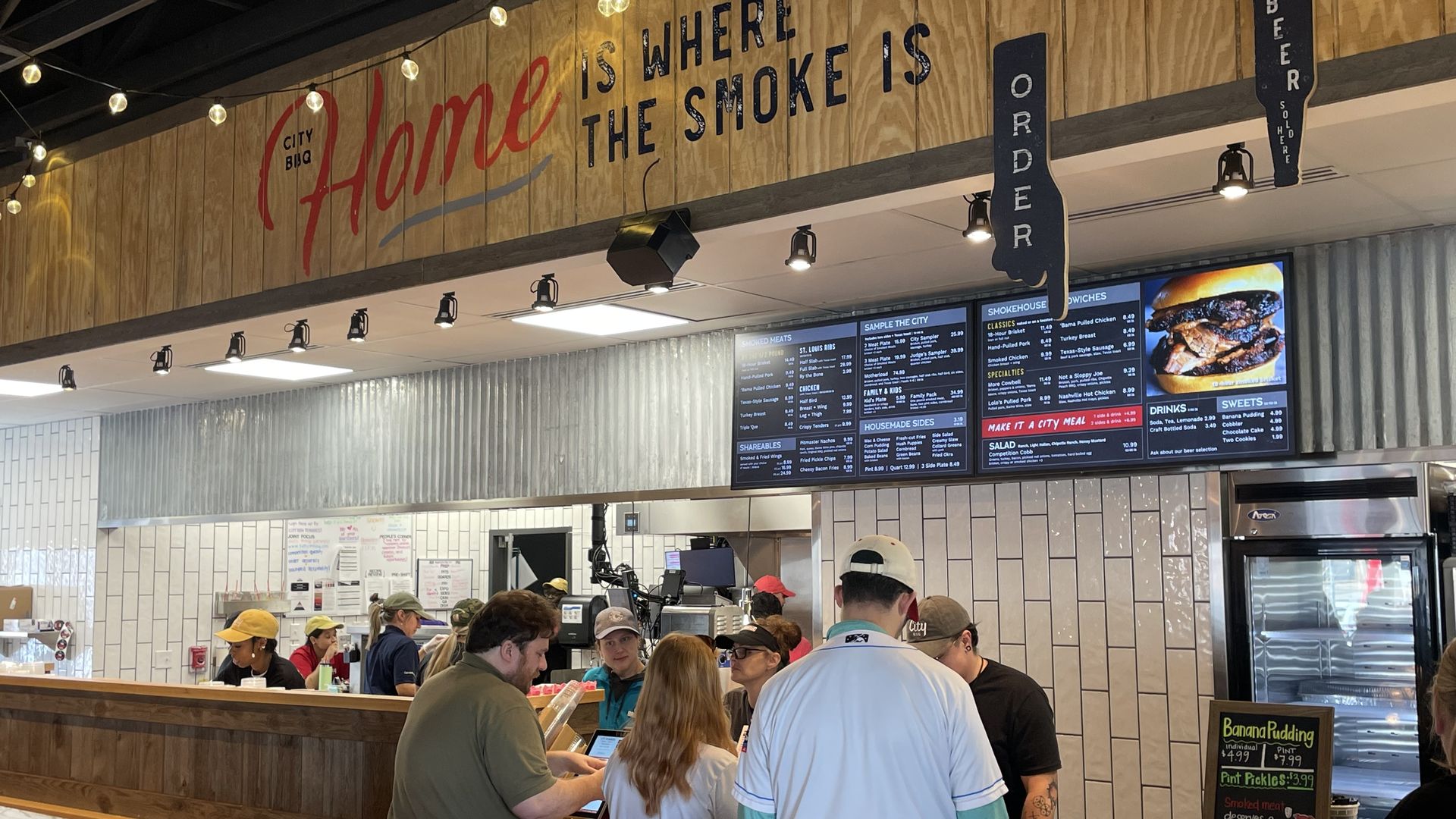 People order food at a barbecue restaurant.