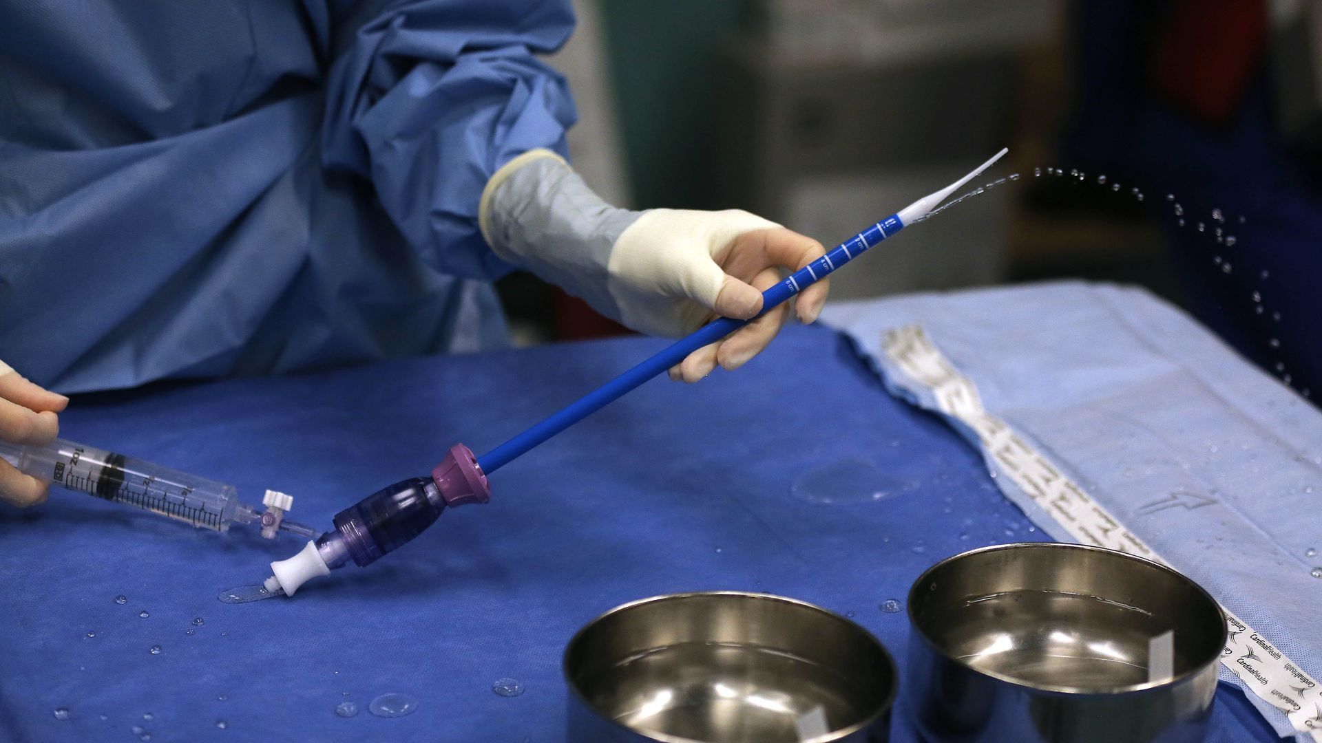 Nurse cleans surgical equipment