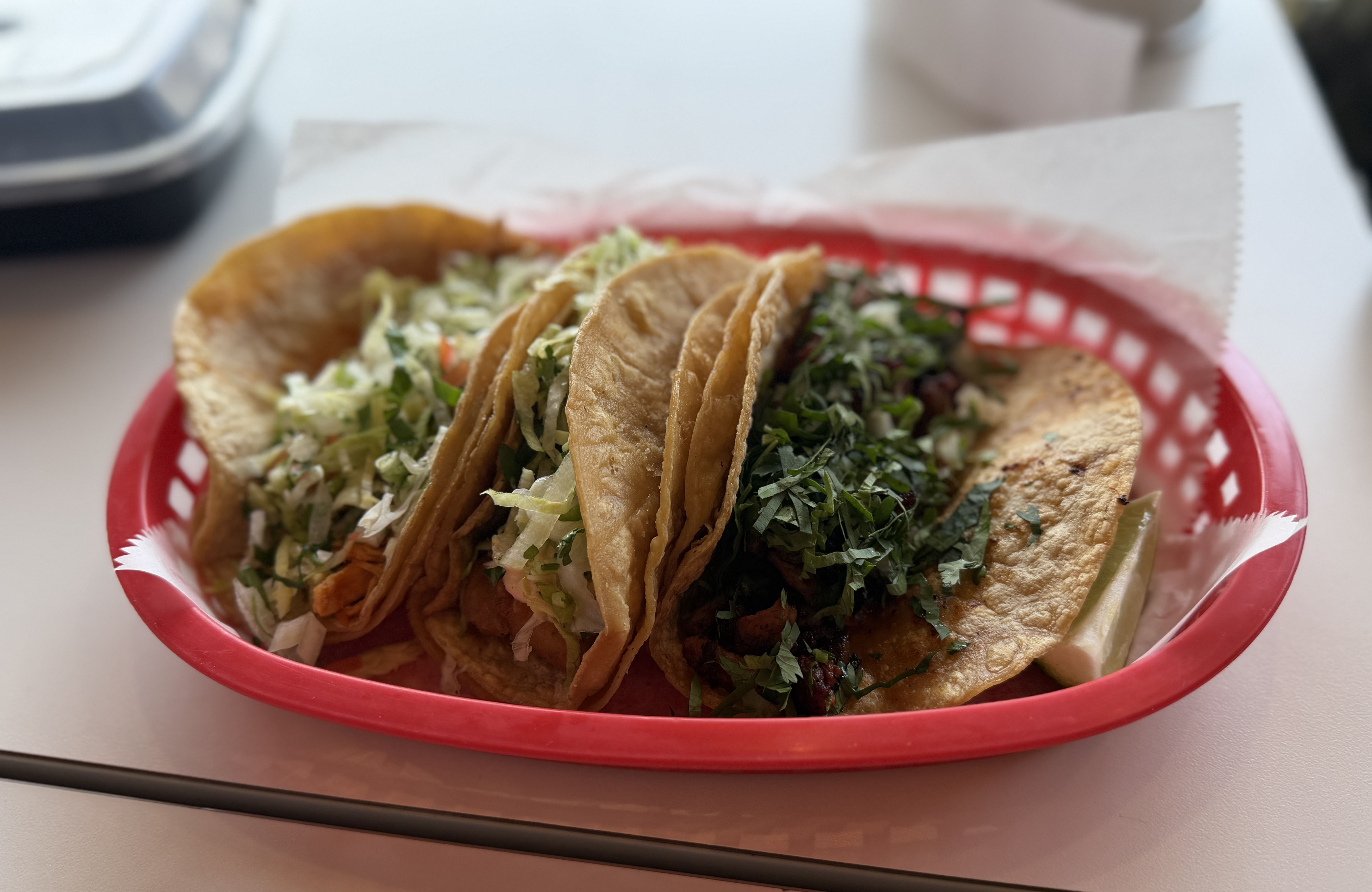 three tacos in a basket