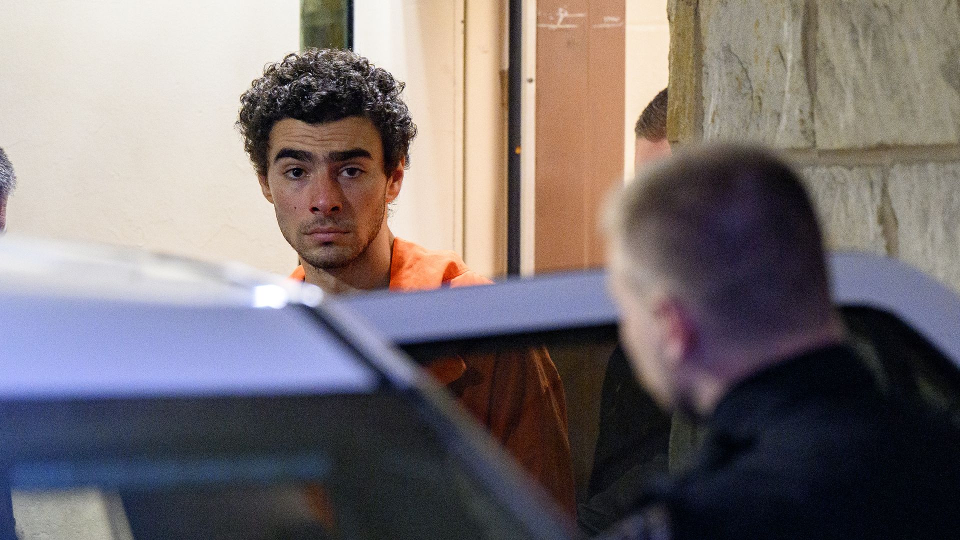 Suspected shooter Luigi Mangione is led from the Blair County Courthouse after an extradition hearing December 10, 2024 in Hollidaysburg, Pennsylvania