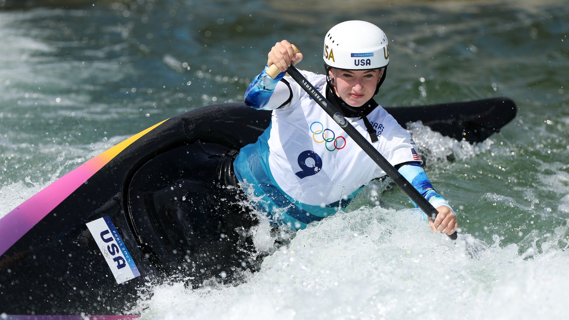 woman competing on the Canoe Slalom in the Paris Olympics