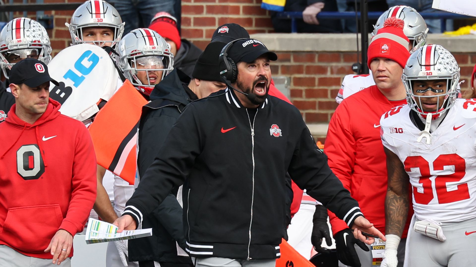 Ohio State's football coach screams towards the field.