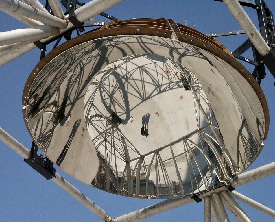 Reflection of person in a steel dome.